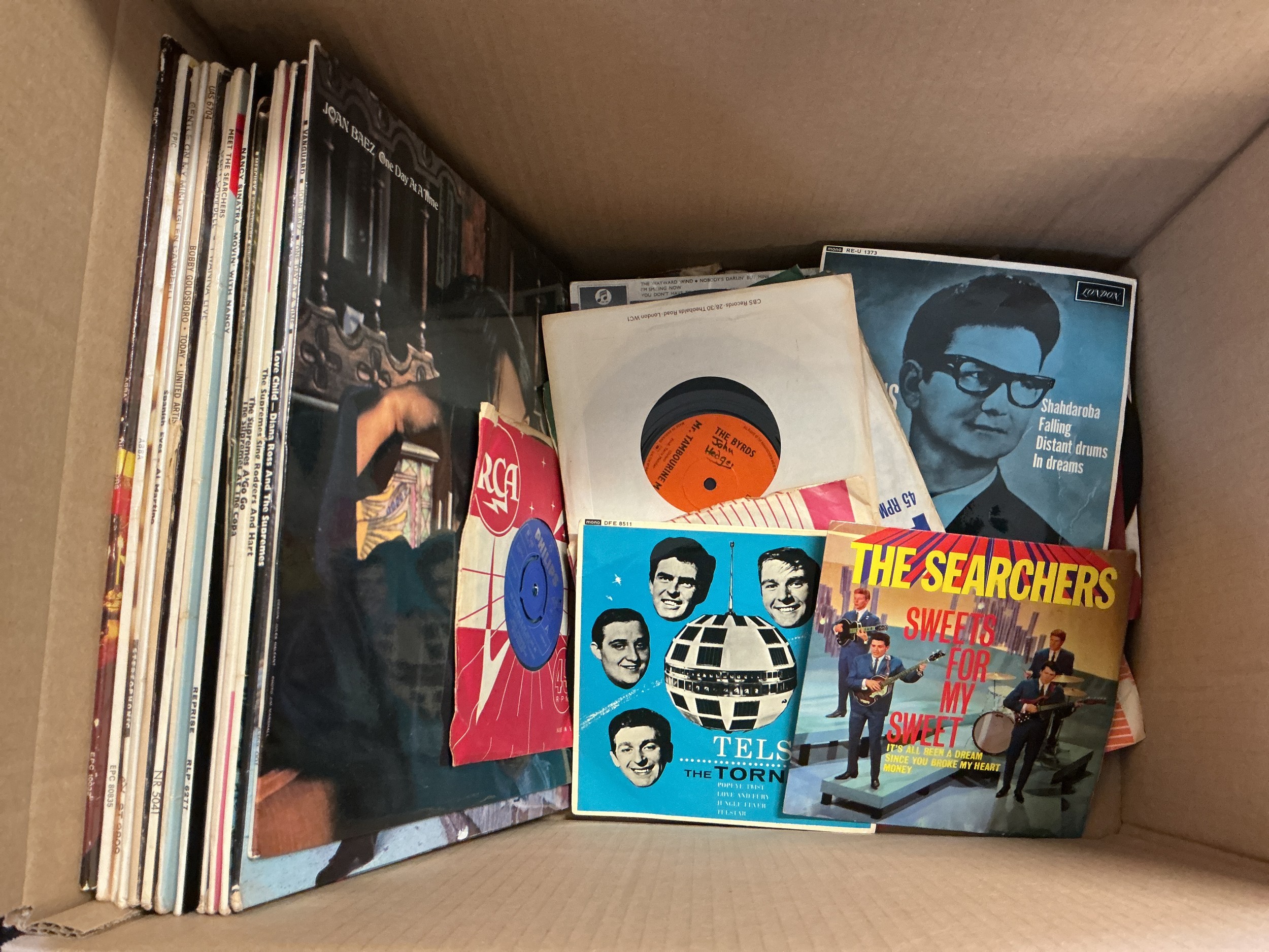 A collection of LPs, EPs and 7" singles by various artists including The Rolling Stones, ABBA, The Byrds and others.