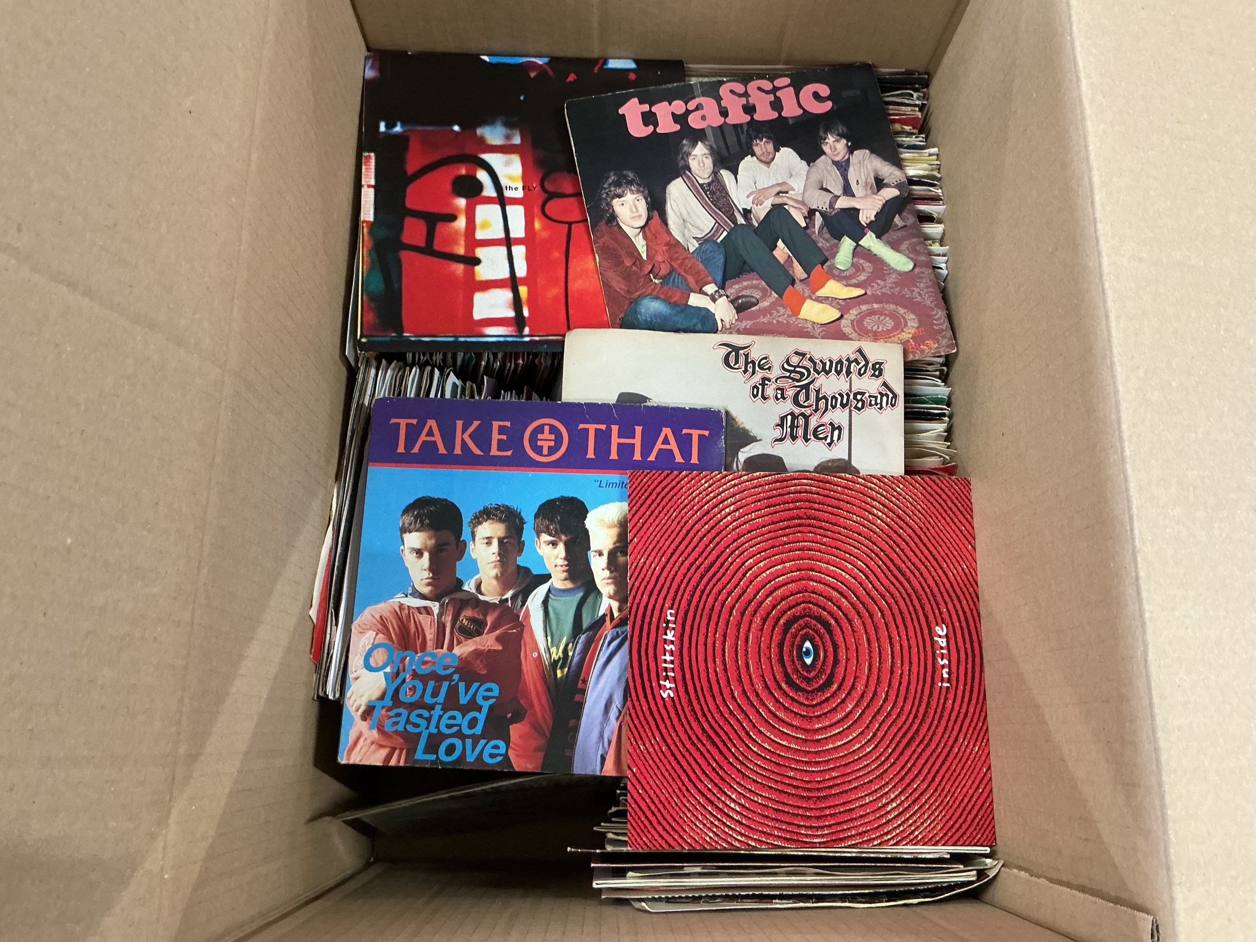 Two boxes of 7" singles by various artists including David Bowie, Duran Duran, Small Faces, Fleetwood Mac and many more.