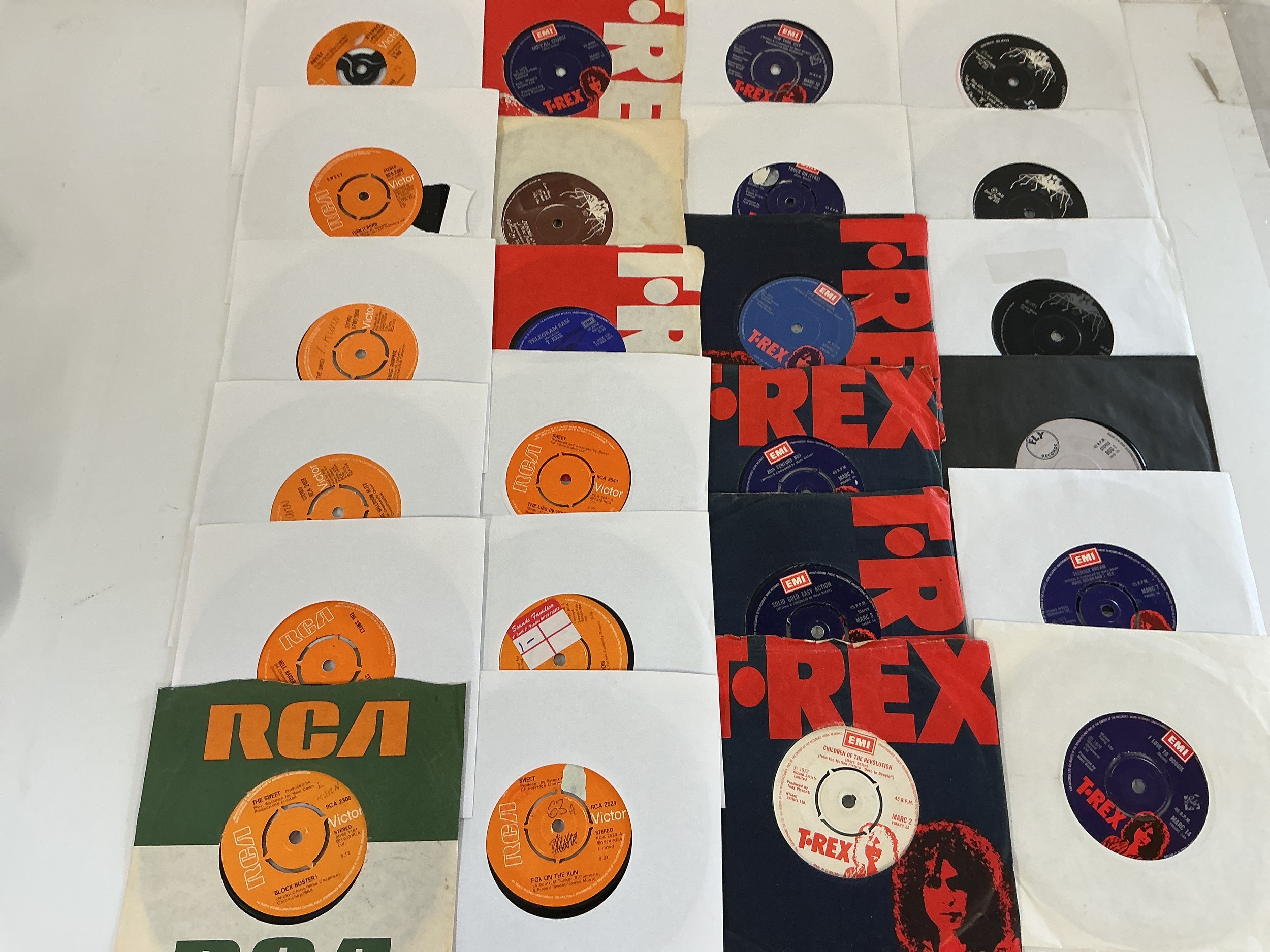 A collection of glam rock 7" singles by T Rex, Slade and The Sweet.