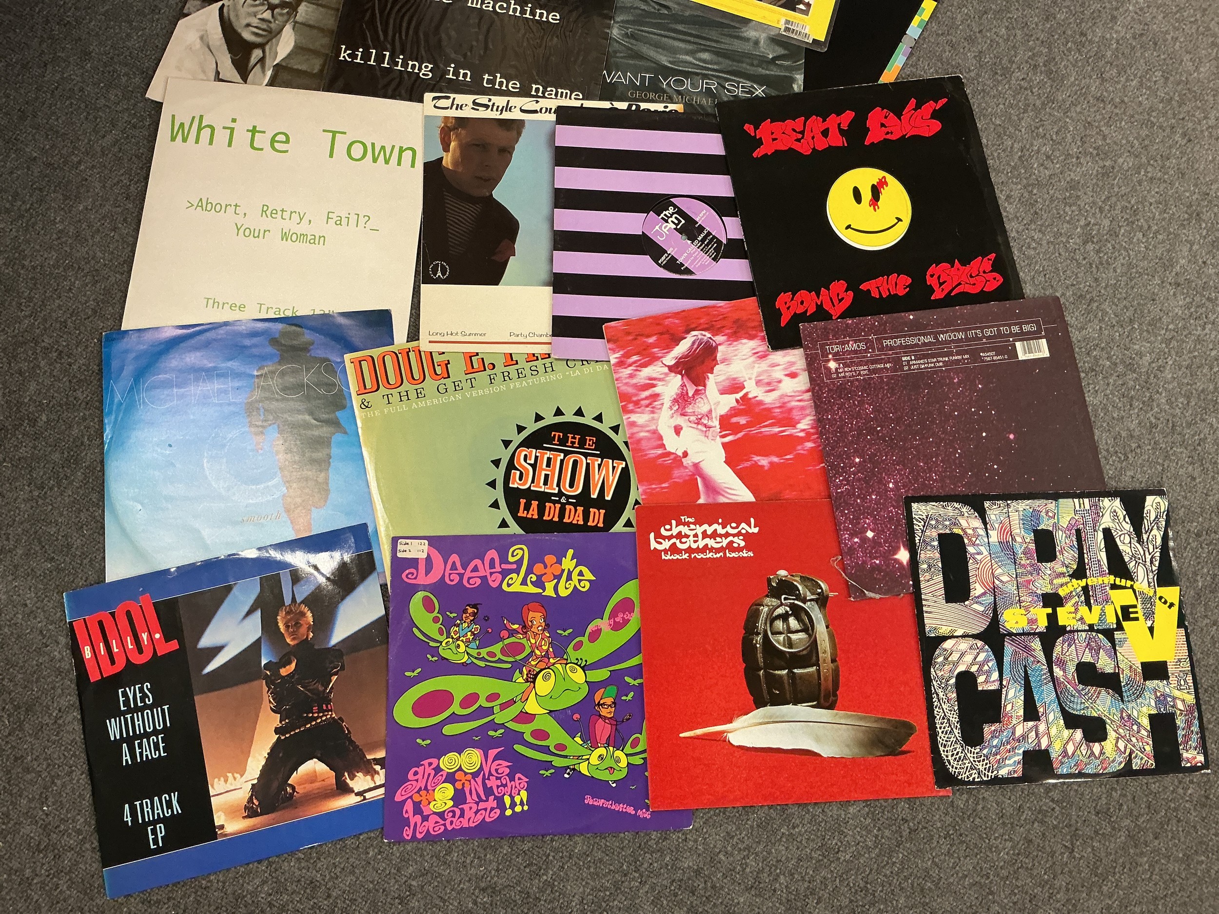 A box of 12" singles by various artists including Rage Against The Machine, Chemical Brothers, The Jam, Tori Amos and many more.
