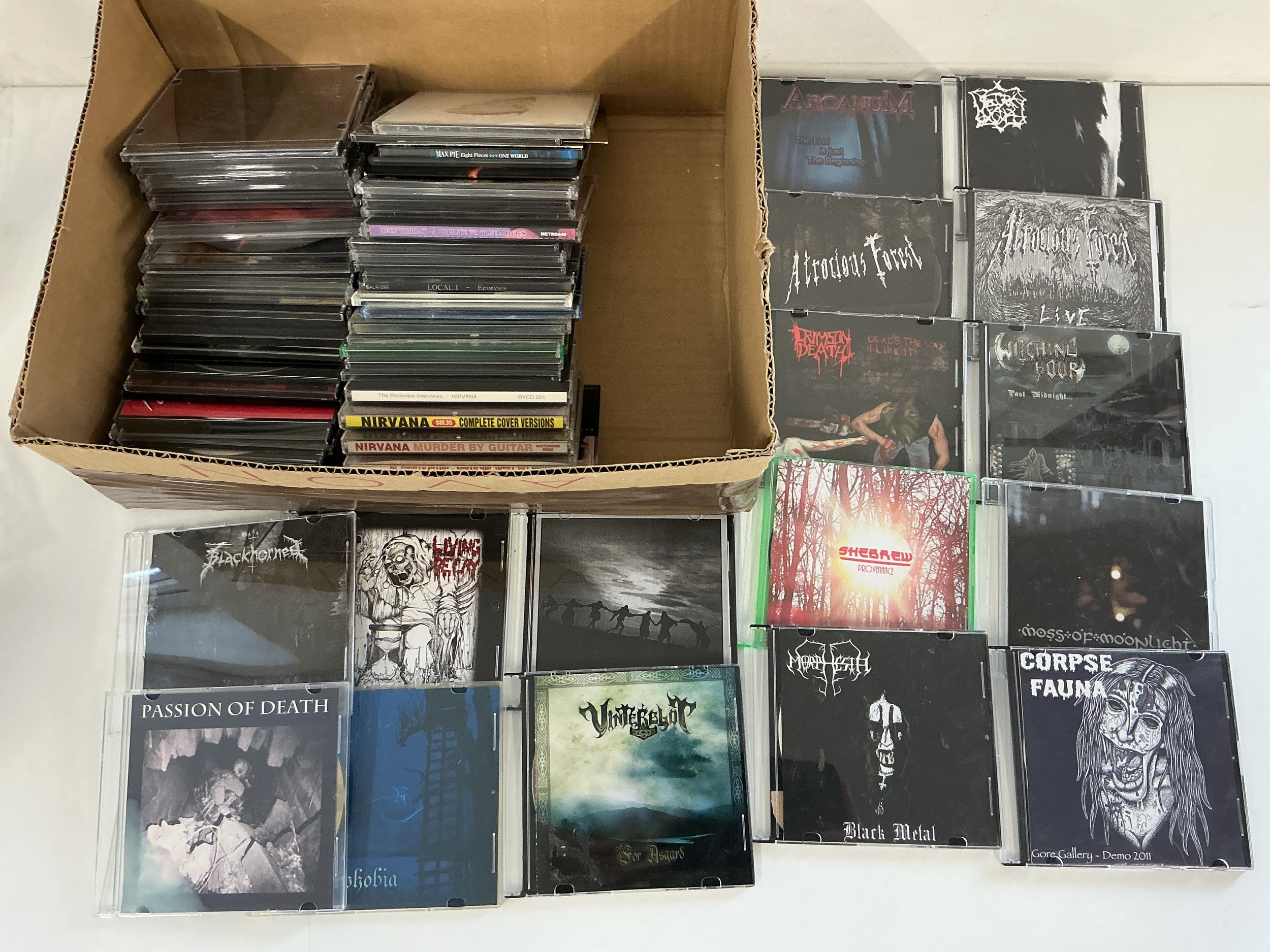 Four boxes of promo and demo CD albums and singles including many doom metal titles.