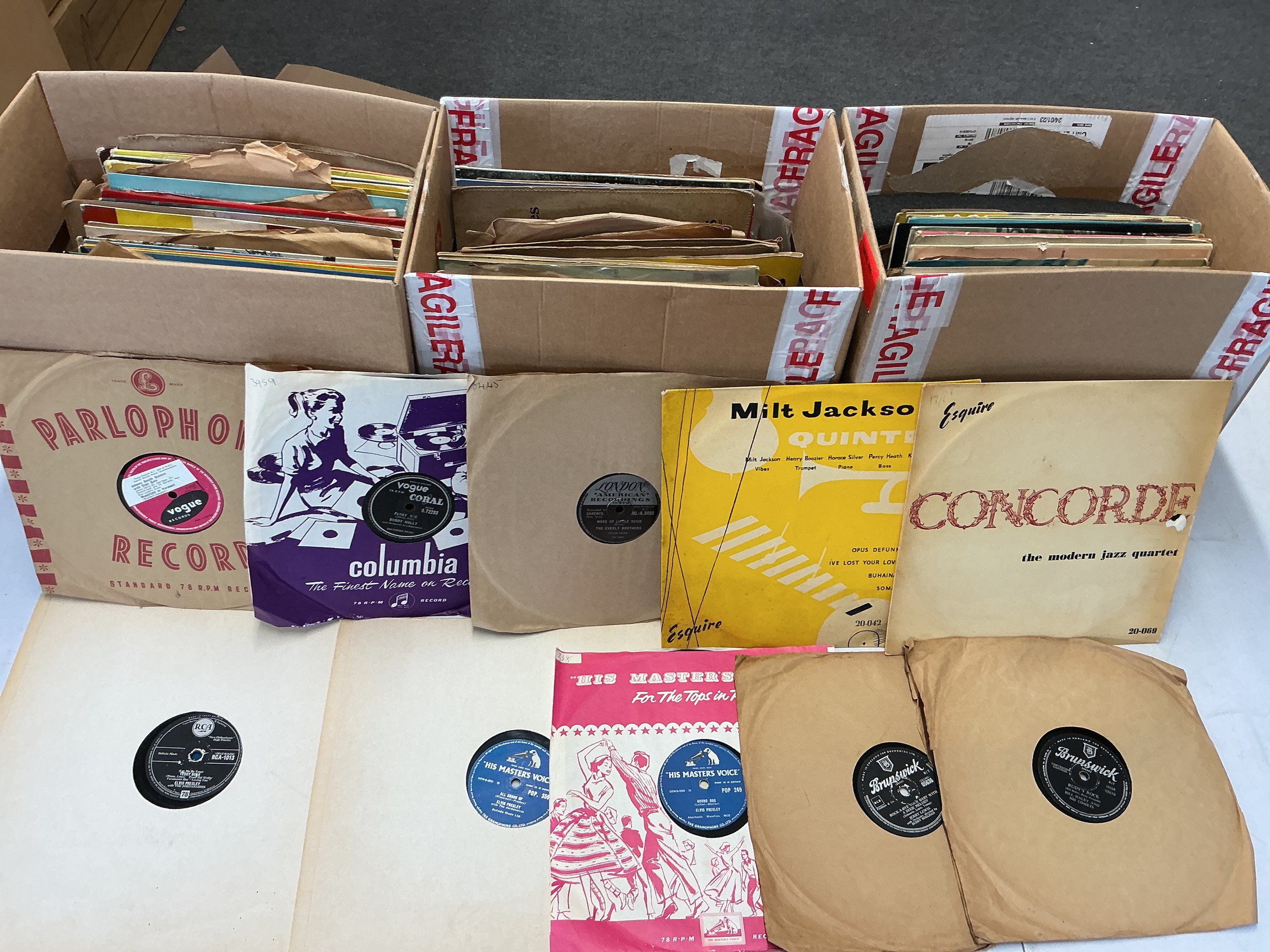 Three boxes of 78s and 10" records including various rock n roll and jazz titles.