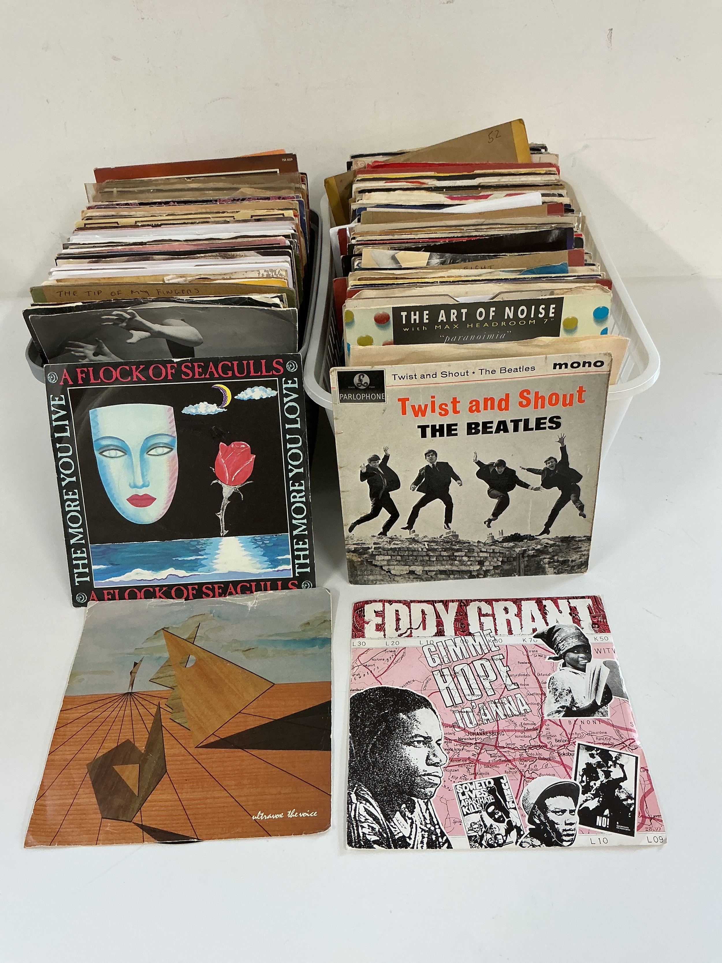 A small collection of 7" singles and EPs by various artists including The Beatles, Queen, Blondie, Marillion and many more.