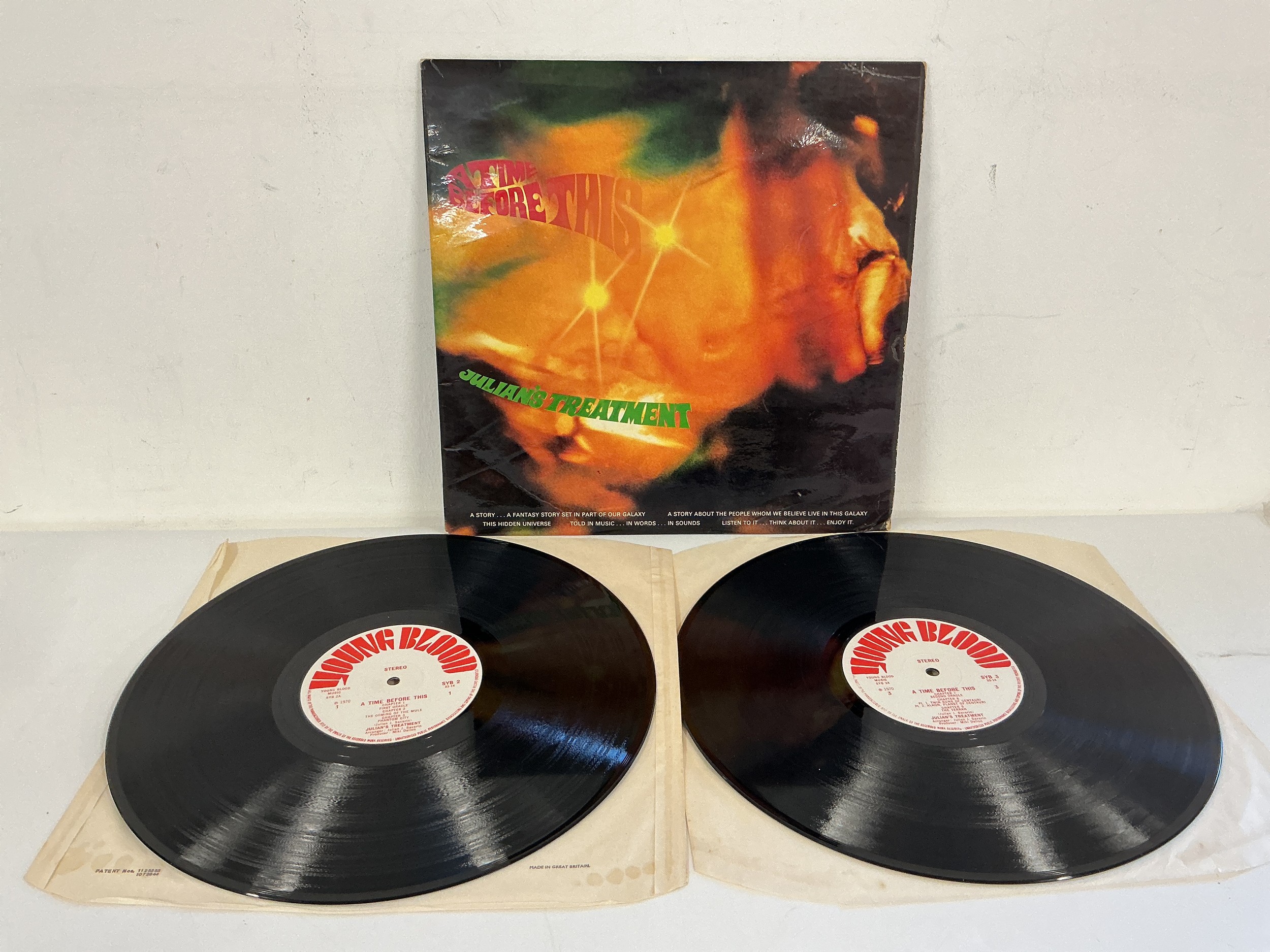 A first UK pressing of the Julian's Treatment LP A Time Before This on the Youngblood label SYB2. One feelable scratch to side 4, otherwise vinyl EX.