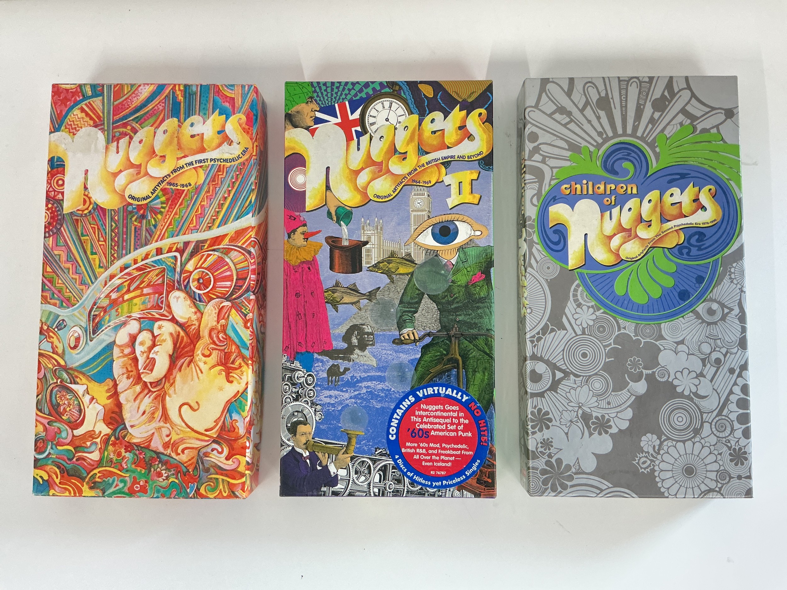 Three Nuggets CD long box sets. Please note that Nuggets II has no plastic liner tray.