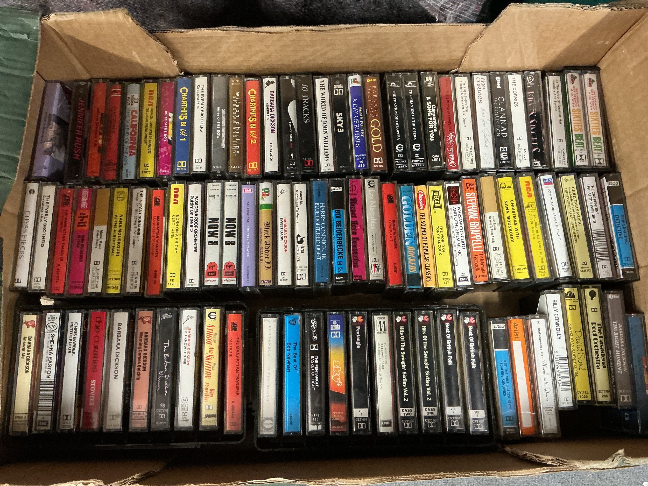 A collection of audio cassettes by various artists including Paul McCartney, Kate Bush, The Stranglers and others.