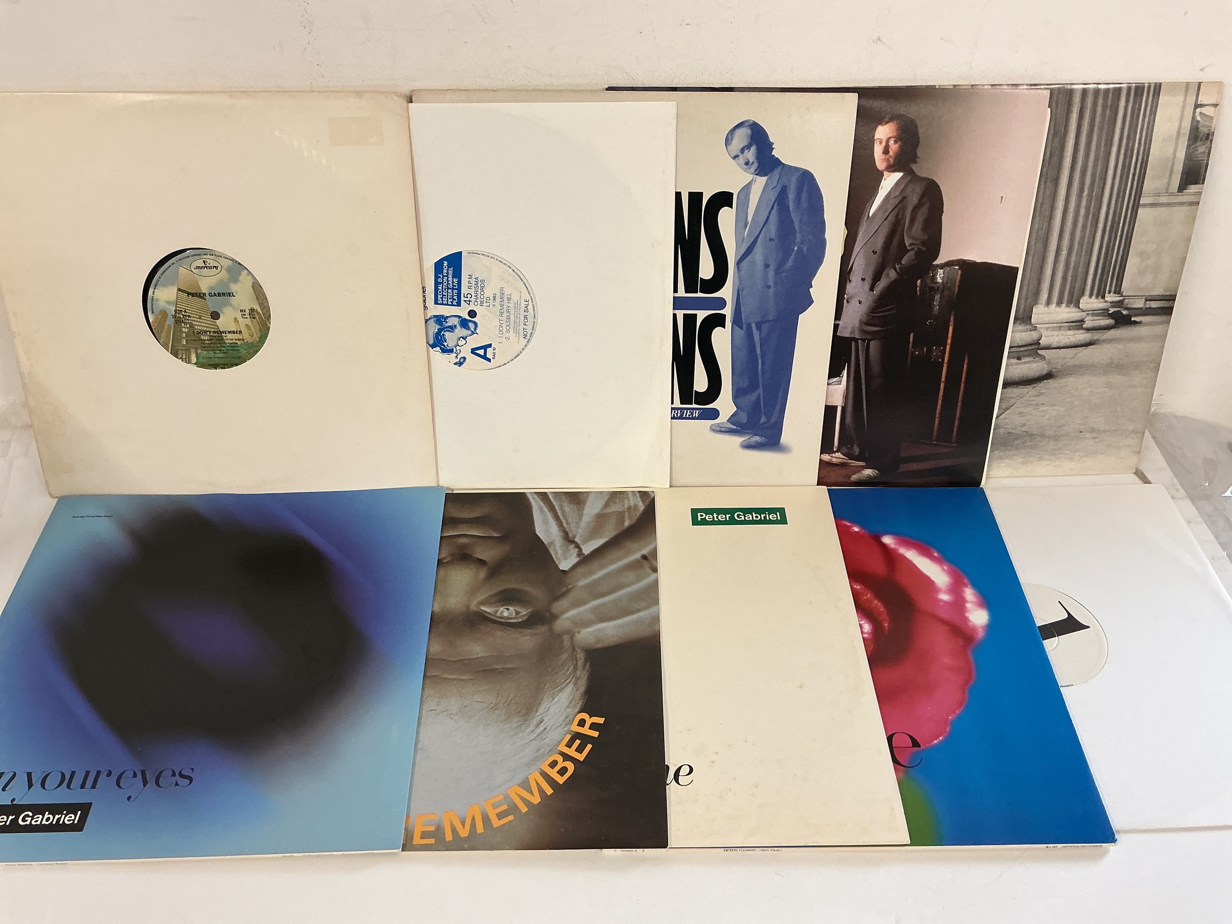 Two bags of over forty 12" singles by various artists including Peter Gabriel, Iggy Pop, David Sylvian and others. Includes promo discs.