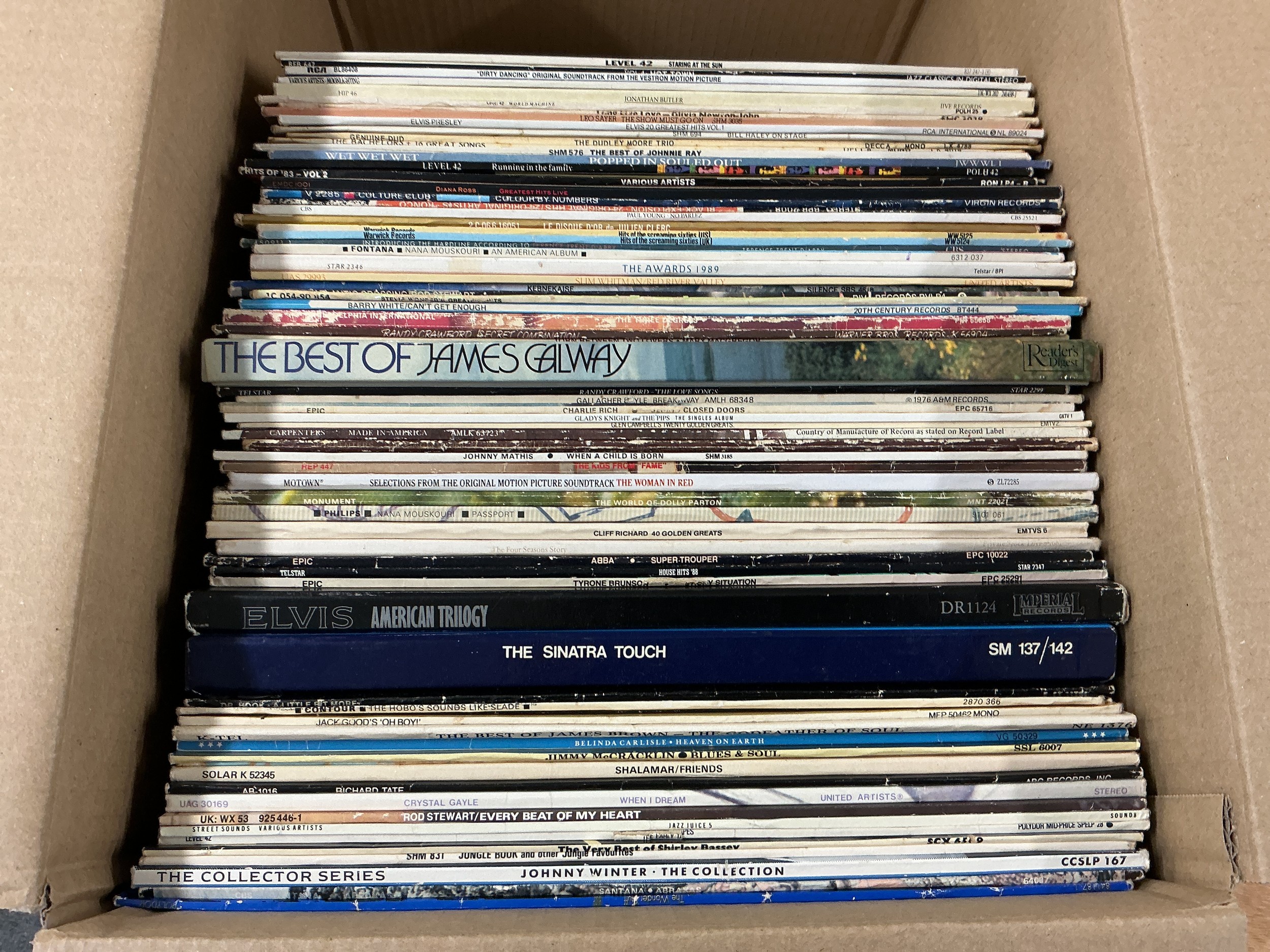 A collection of LPs and 12" singles by various artists including Johnny Winter, The Wonder Stuff, Level 42 and others.