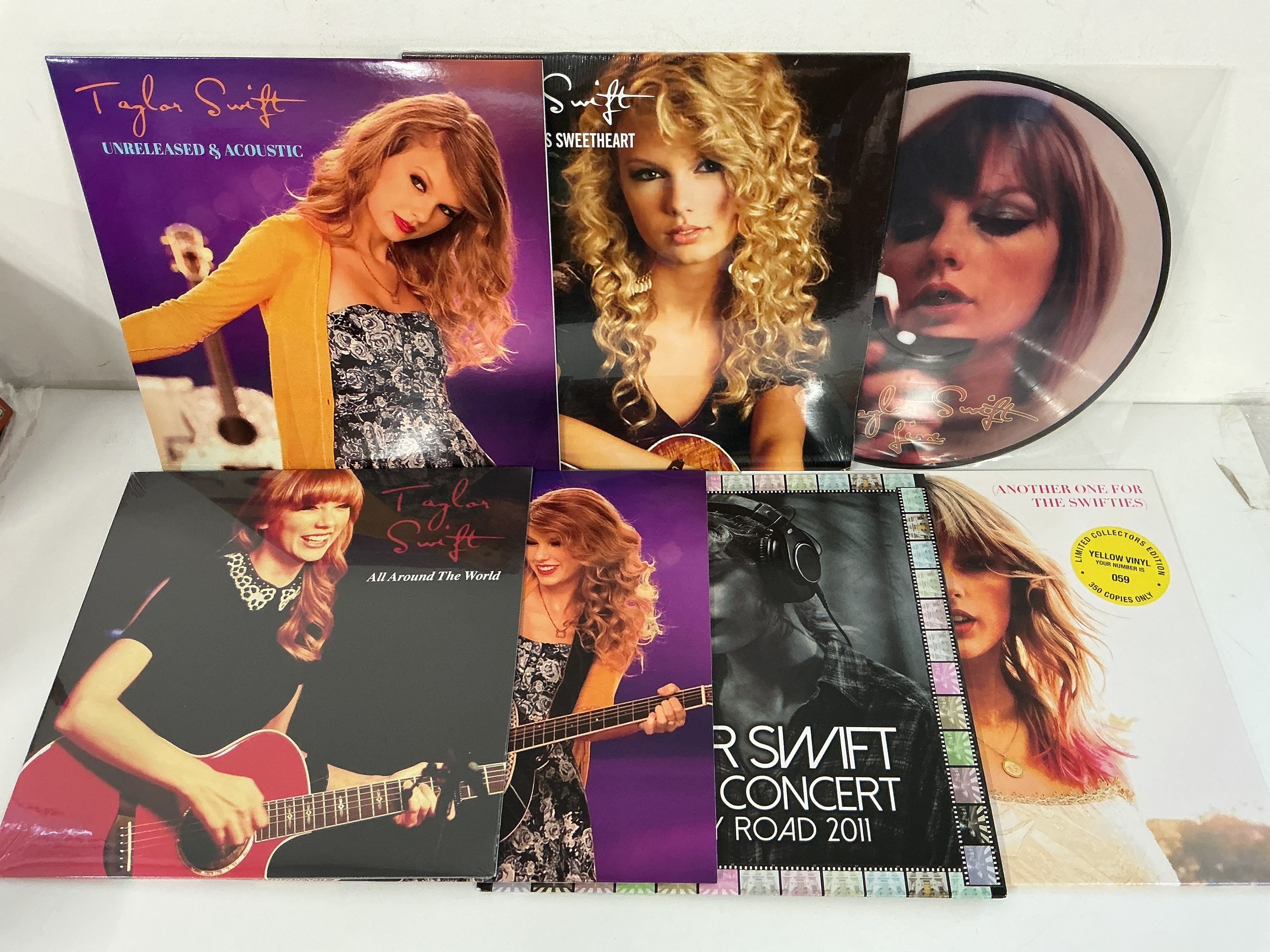 Seven Taylor Swift LPs including a picture disc and coloured vinyl.
