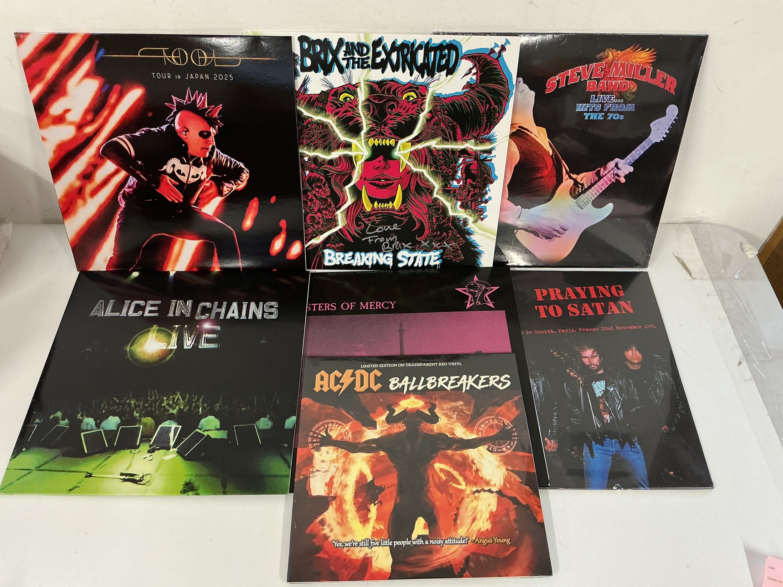 Seven rock LPs by various artists including AC/DC (10" red vinyl), Alice In Chains, Tool and others. Includes coloured vinyl and sealed examples.