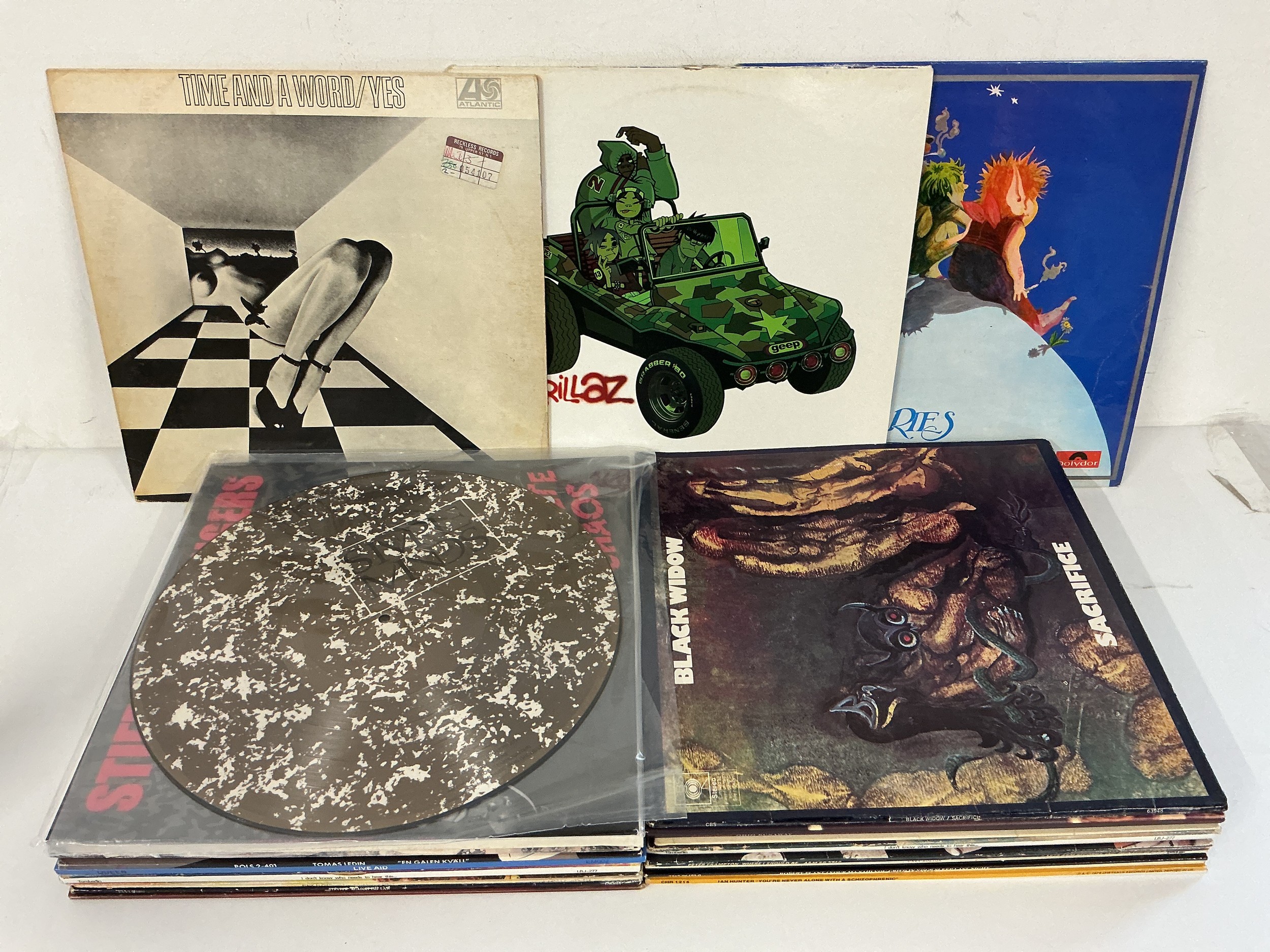 Two bags containing 27 LPs by various artists including Yes, Pink Fairies, Gentle Giant, Gorillaz and others.