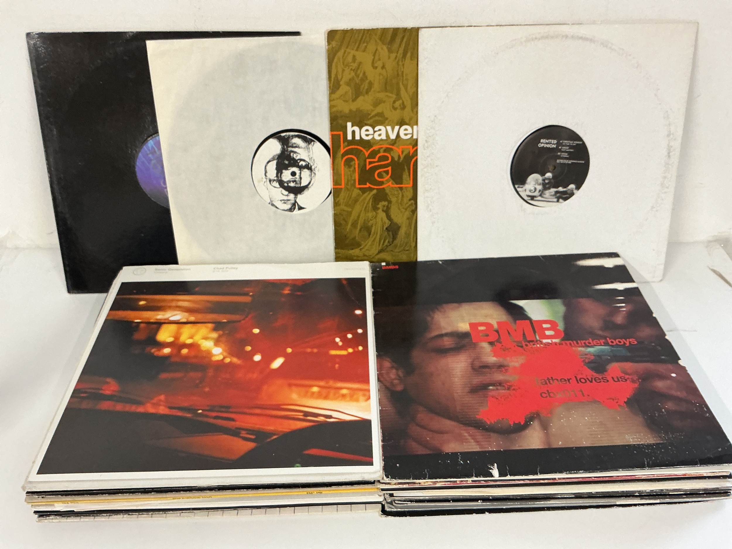 Two bags containing a collection of over thirty house, techno, trance and hip hop 12" singles and white labels.