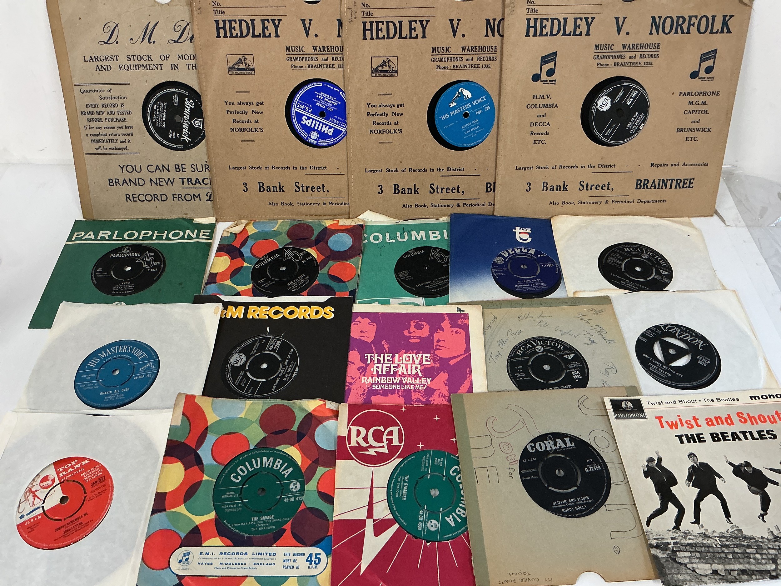A collection of rock n roll and 60s pop 7" singles, EPs and 78s by various artists including Elvis Presley, The Beatles, The Shadows and many more.