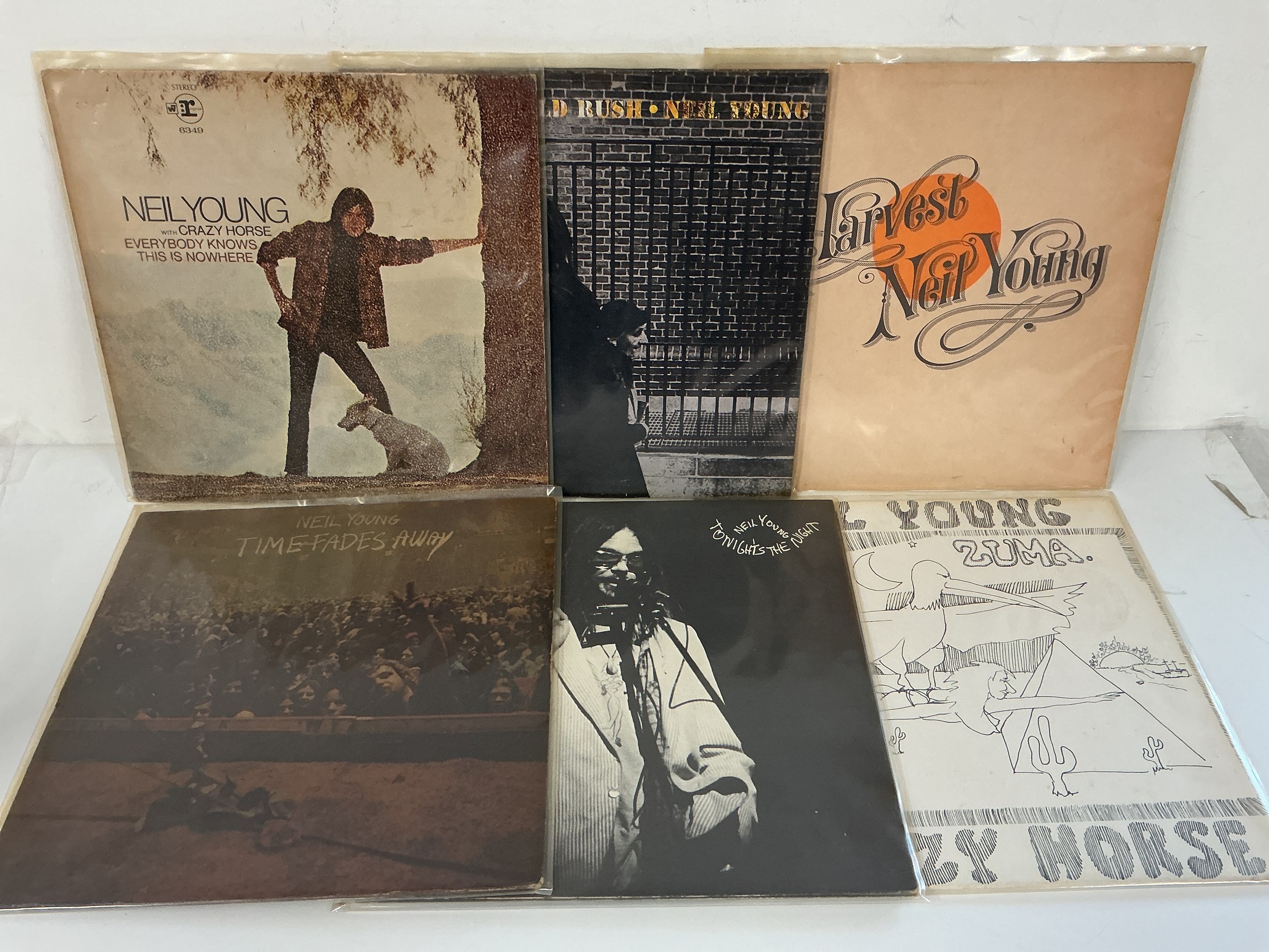 Six Neil Young LPs comprising Everybody Knows This Is Nowhere, After The Gold Rush, Harvest and others. Please note there is a discernible odour of old cigarette smoke to this lot.