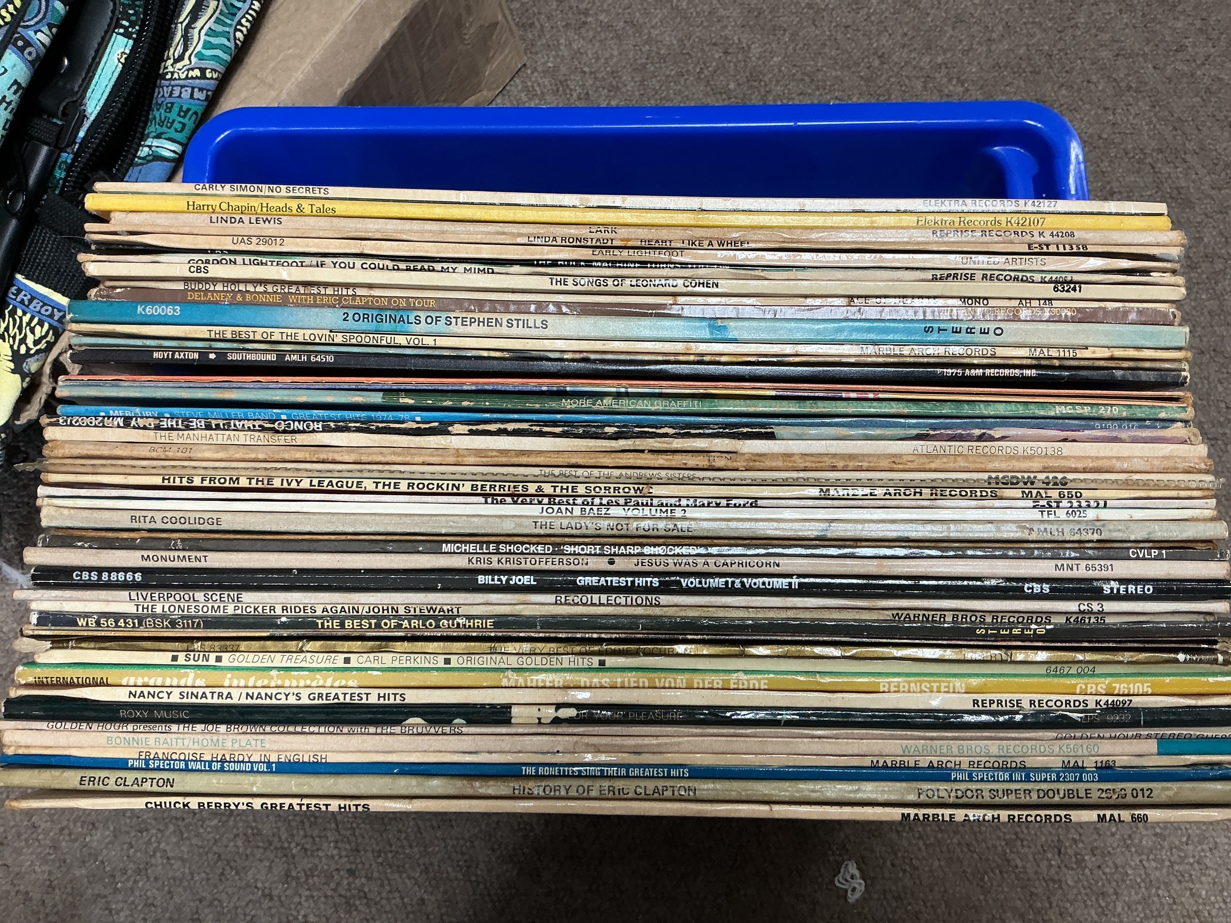 A collection of LPs by various artists including Stephen Stills, Leonard Cohen, Gordon Lightfoot and others.