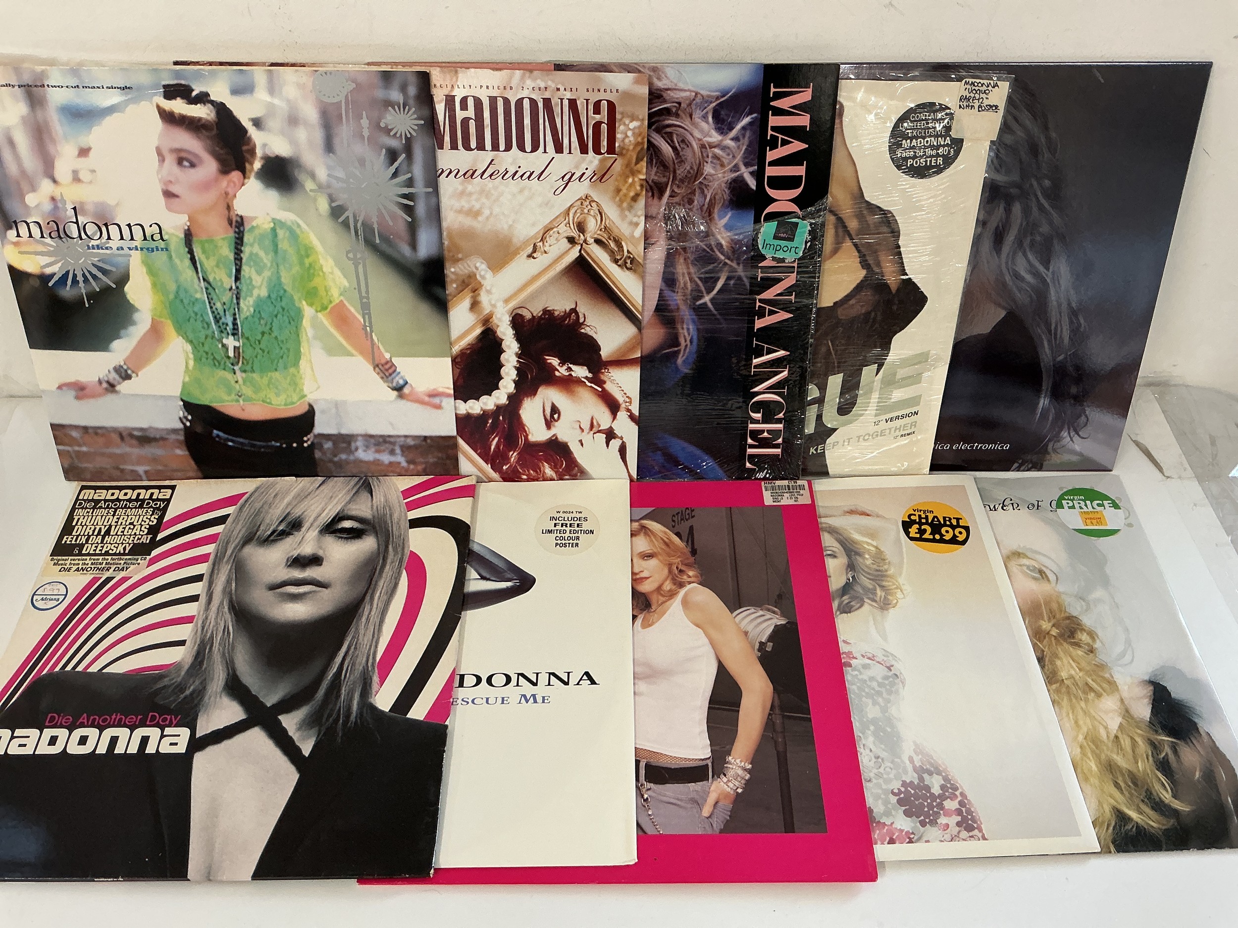 Two bags containing twenty Madonna 12" singles comprising Like A Virgin, Material Girl, Borderline and others.