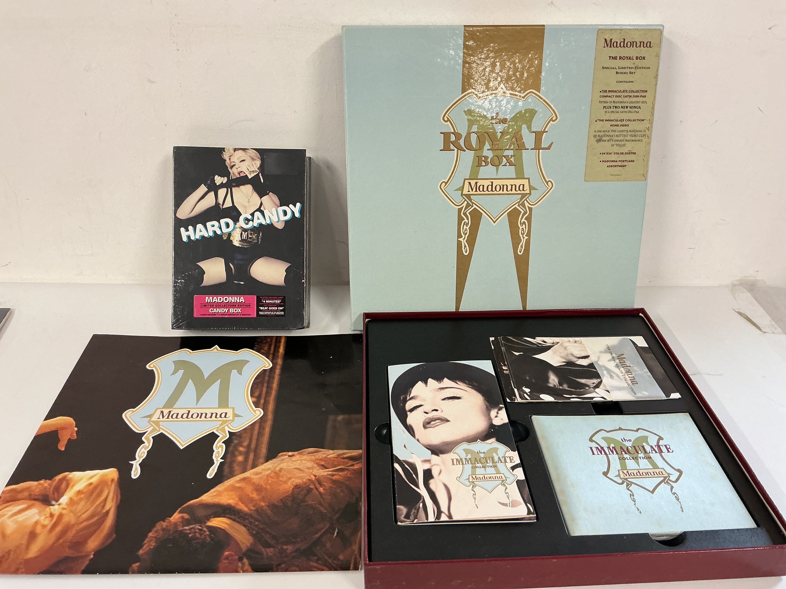 A Madonna Royal Box CD/VHS box set and a sealed Hard Candy box set.