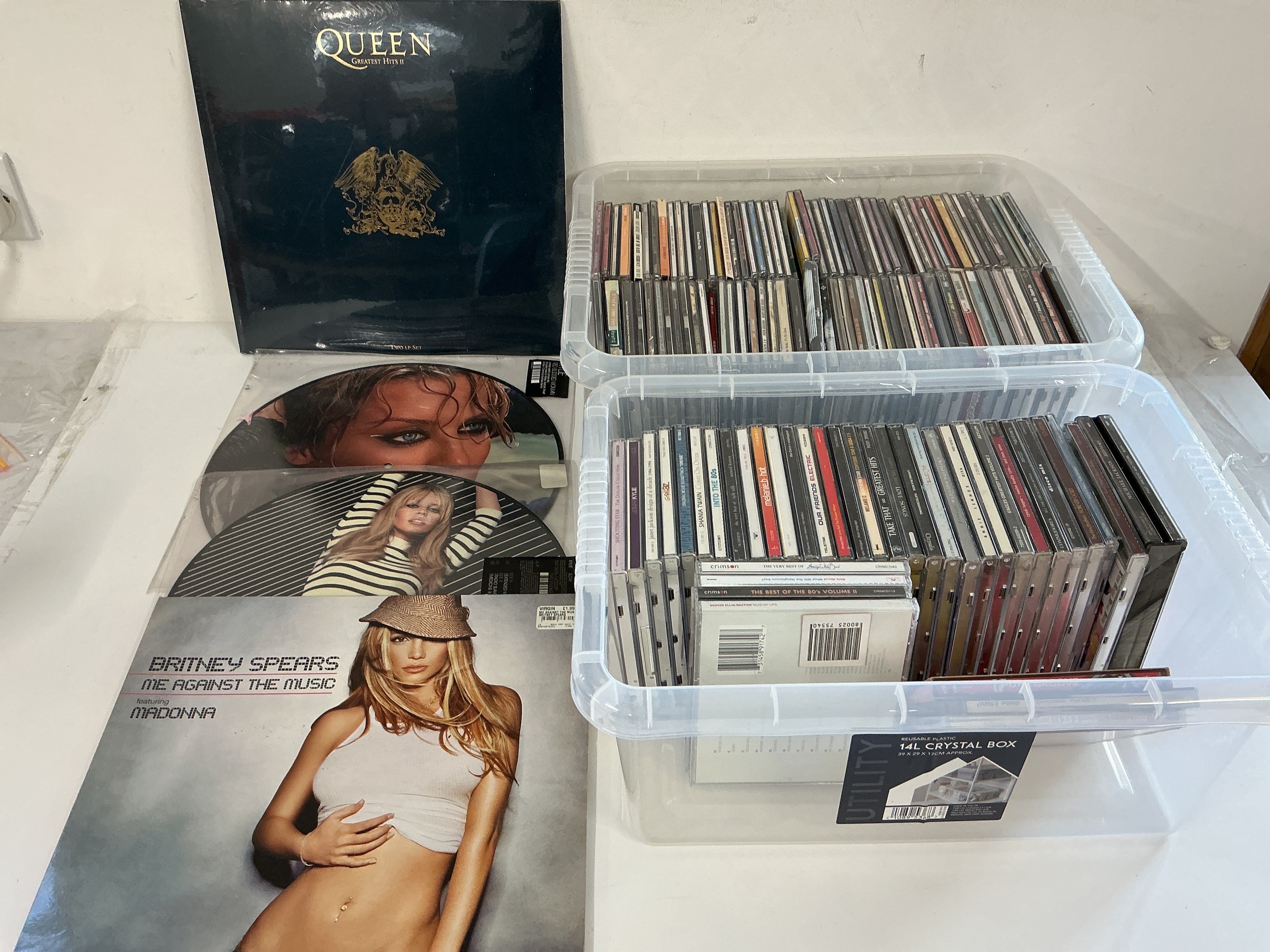 A sealed Queen 2LP Greatest Hits II, two Kylie Minogue 12" single picture discs, a Britney Spears 12" single and a collection of CDs.