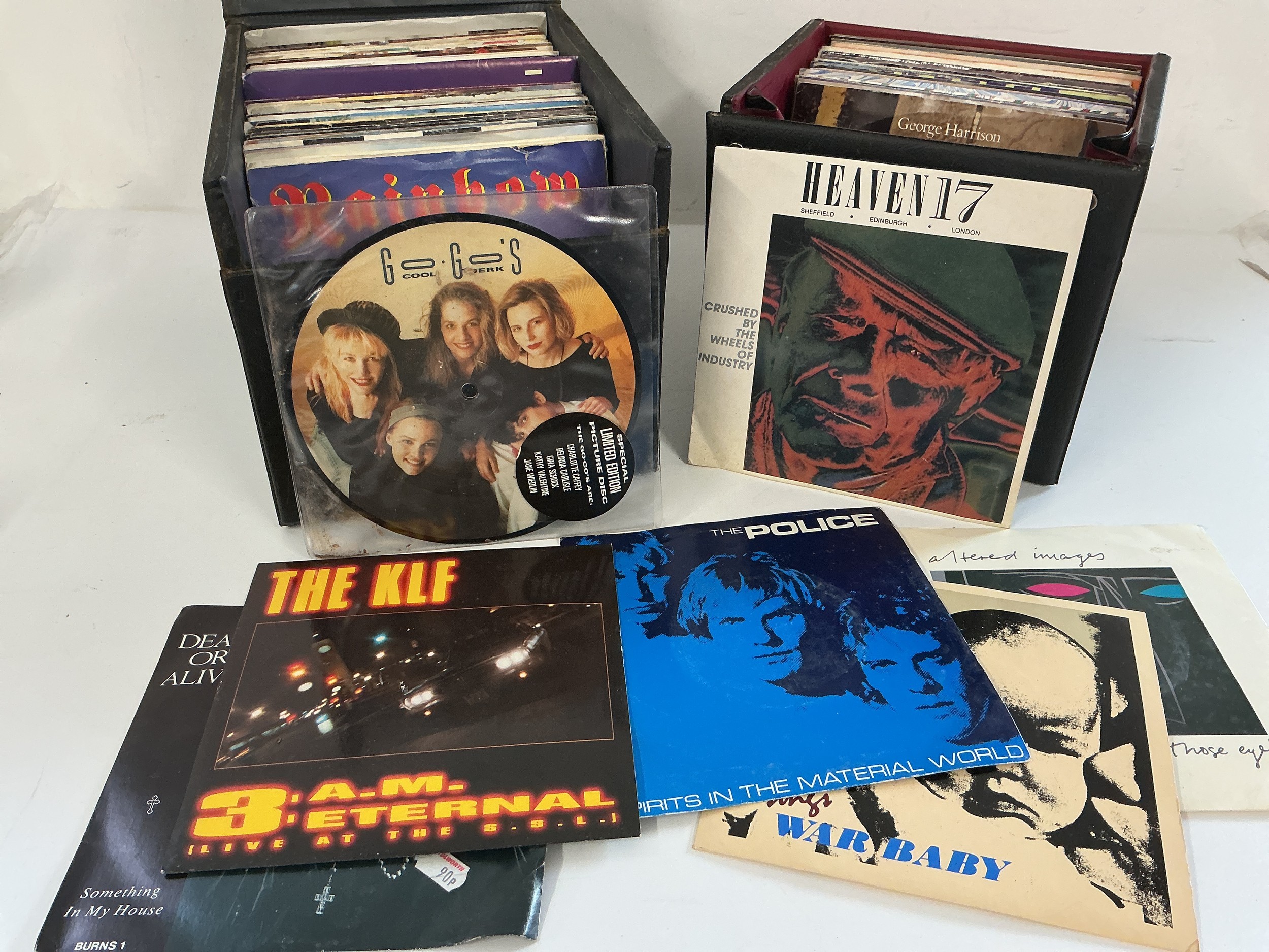 Two record cases of 7" singles by various artists including The KLF, Altered Images, The Jam and many more.