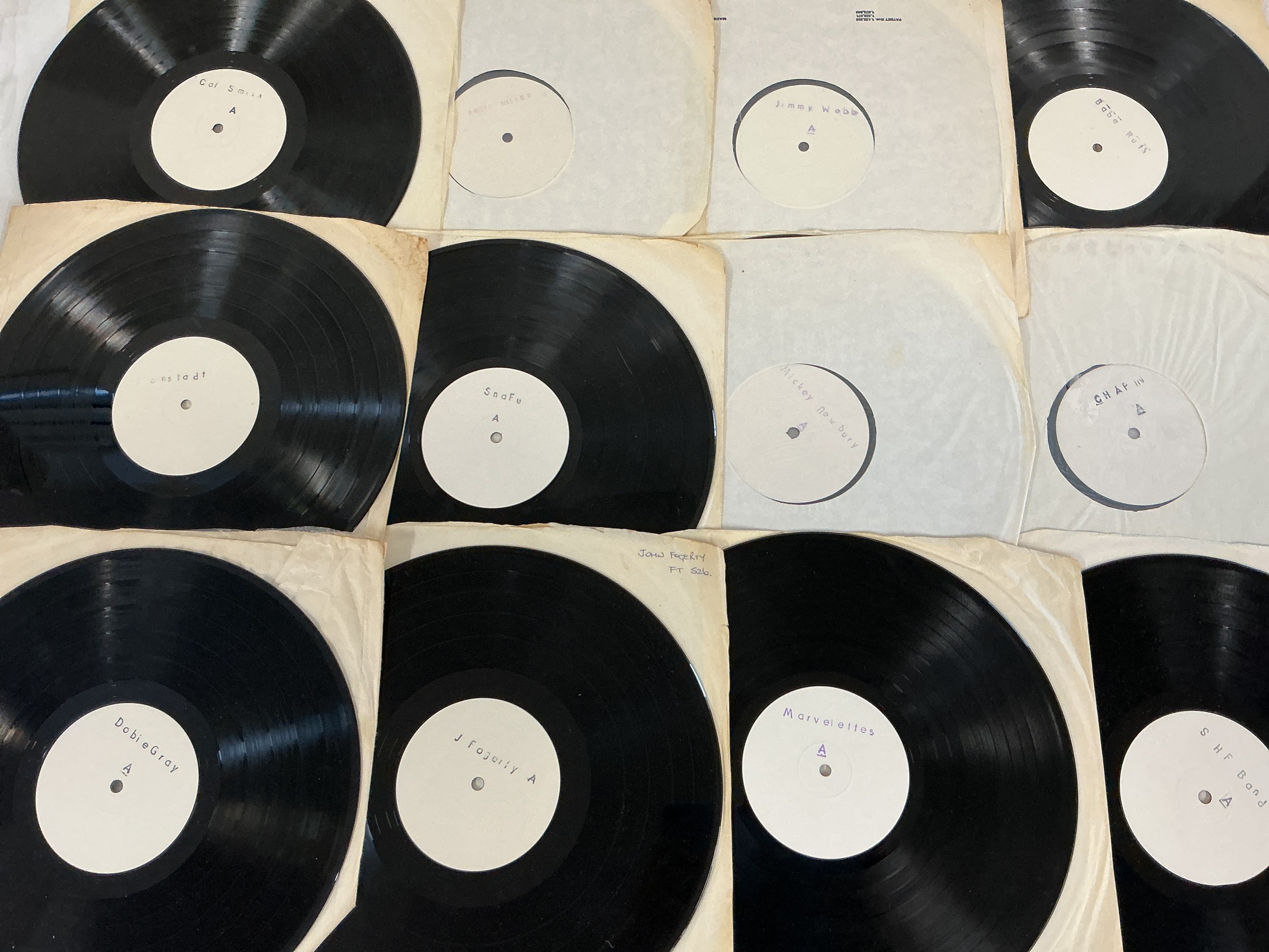A collection of white labels and demo discs, 12" and 7" by various artists including Deep Purple, John Fogerty, Jimmy Webb and others.