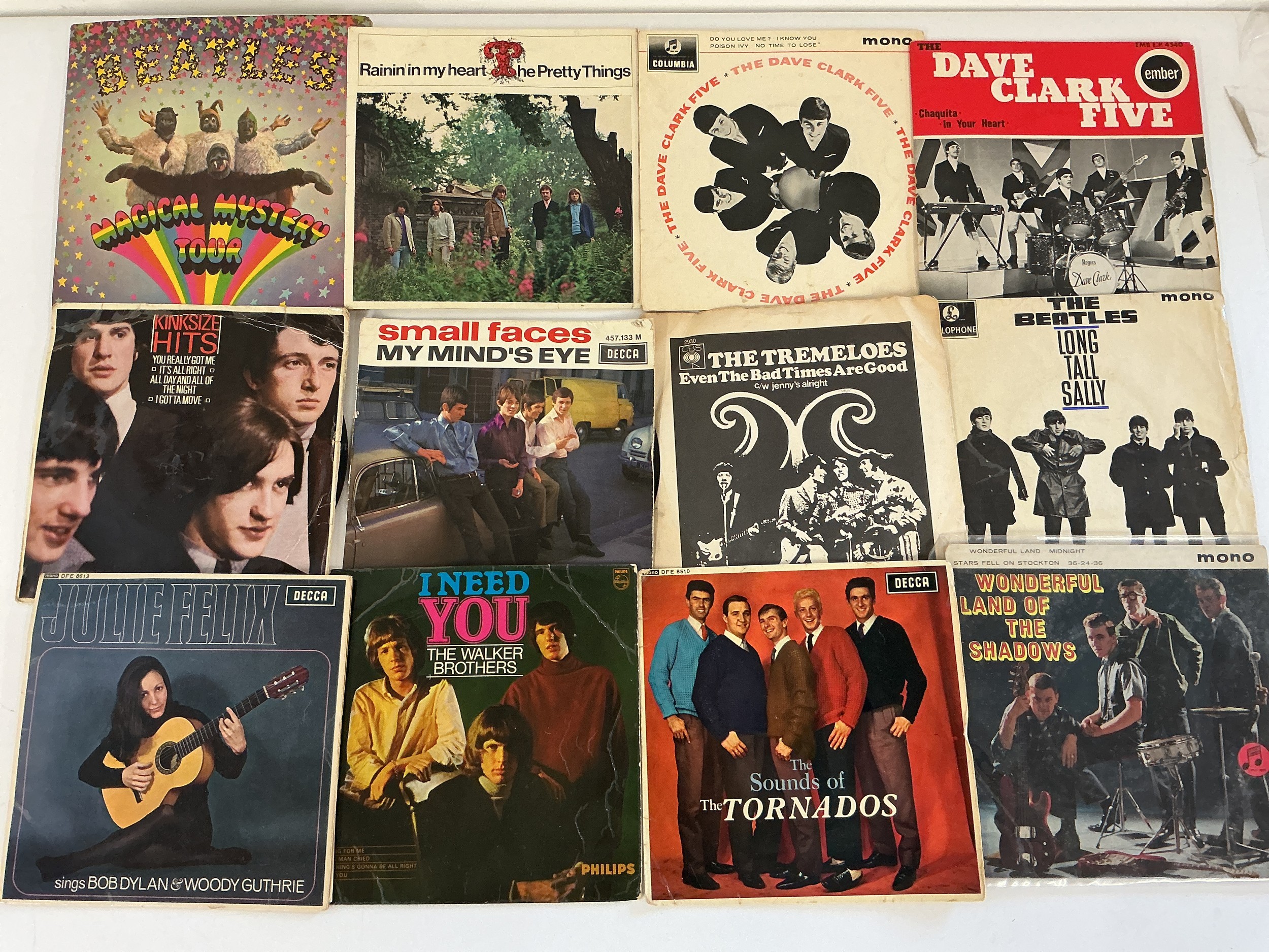 A collection of 1960s 7" singles and EPs by various artists including The Beatles, Small Faces, The Kinks and others.