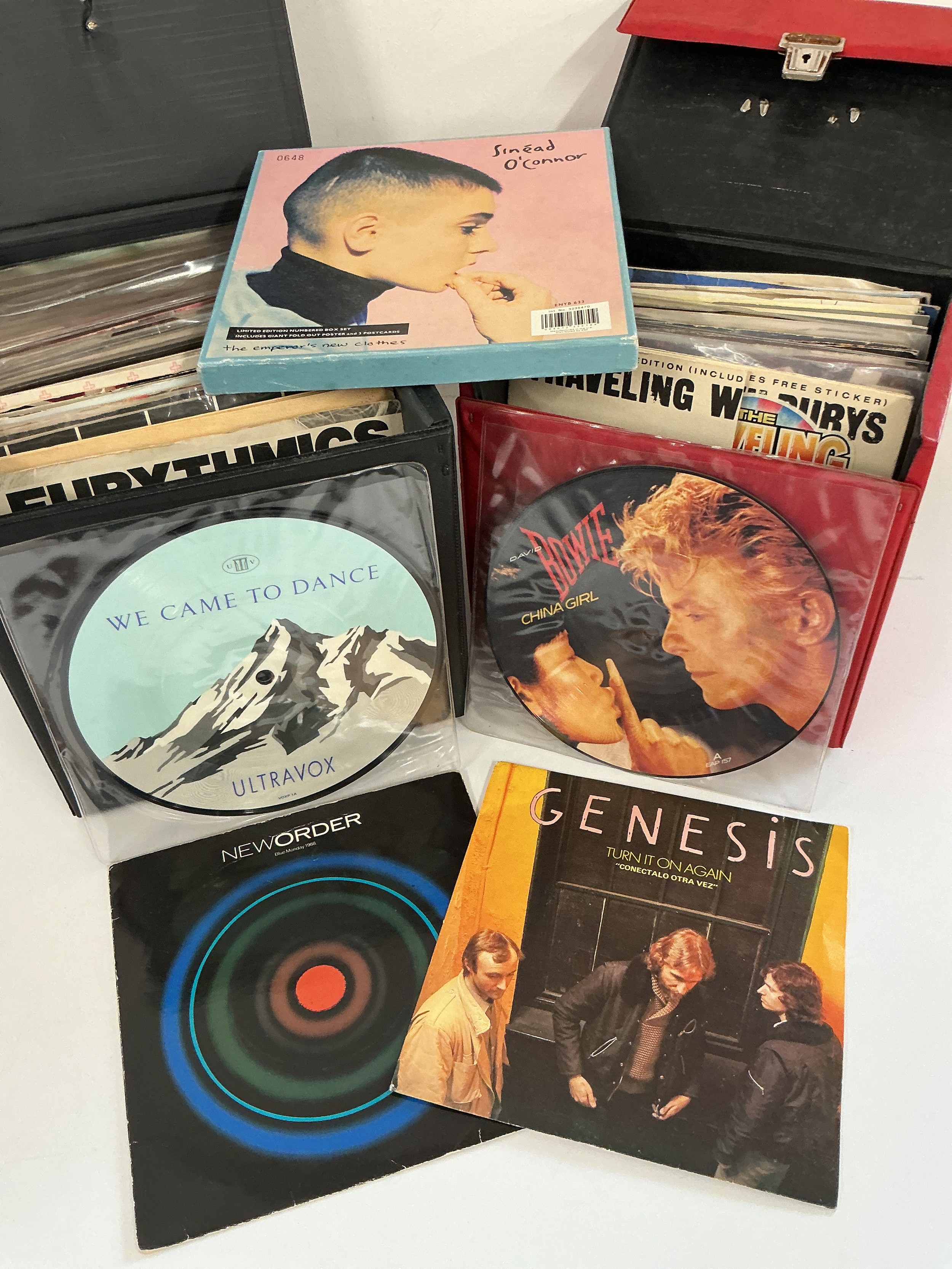 Two record cases of 7" singles, mainly 1980s artists, including some picture discs.
