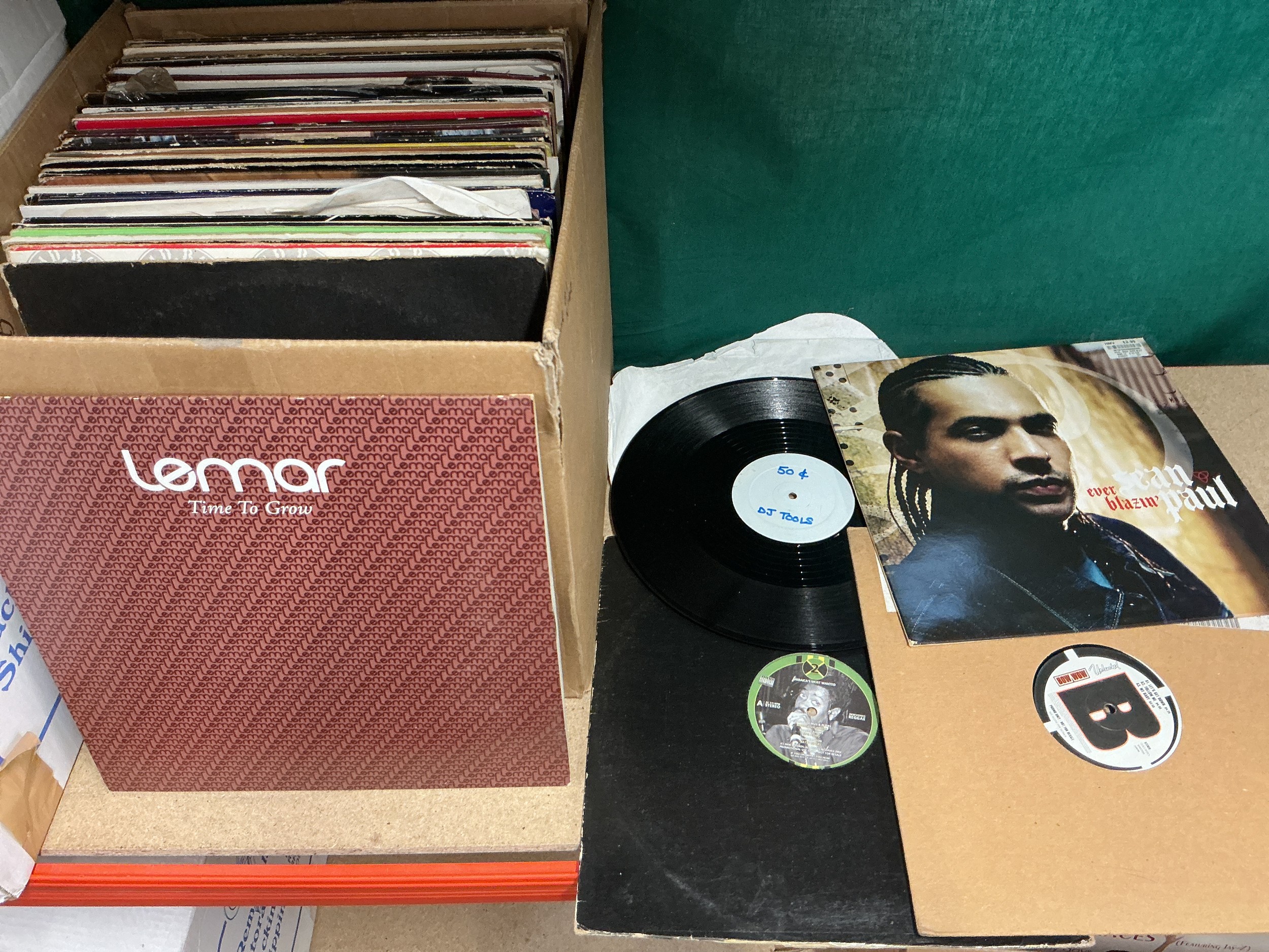 A box of hip hop, house and RnB LPs and 12" singles including white labels and promos.