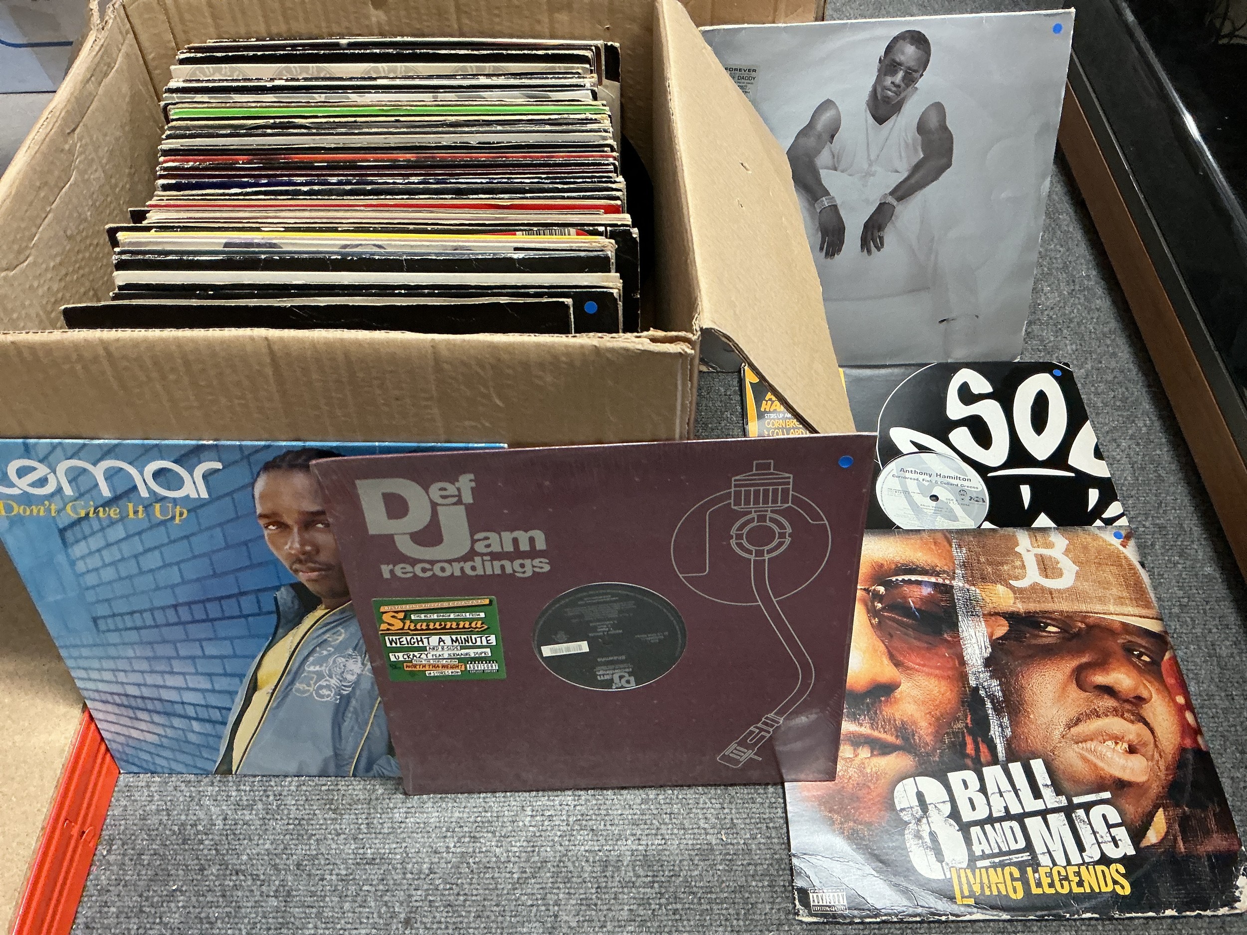 A box of hip hop, house and RnB LPs and 12" singles including white labels and promos.