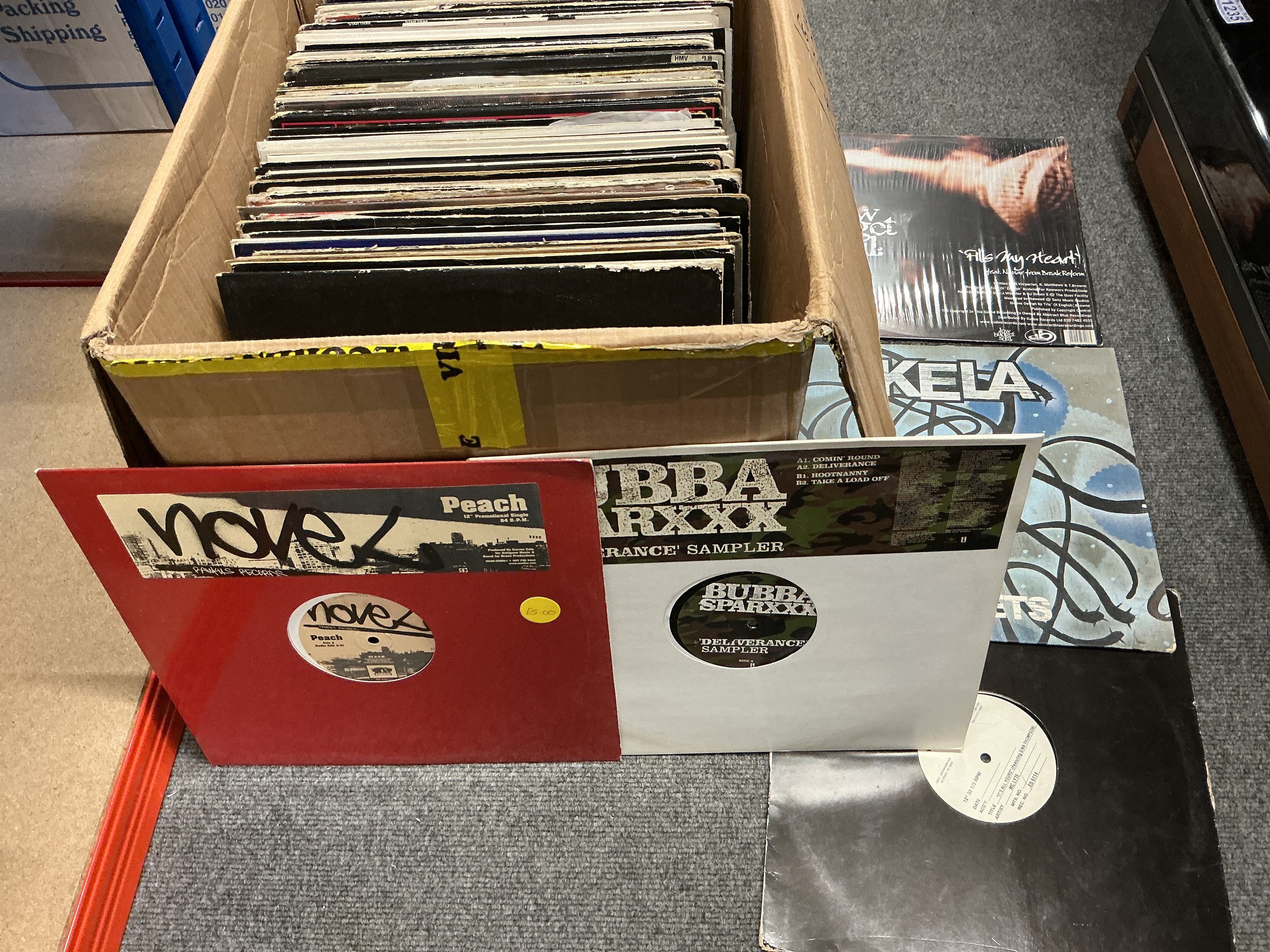 A box of hip hop, house and RnB LPs and 12" singles including white labels and promos.