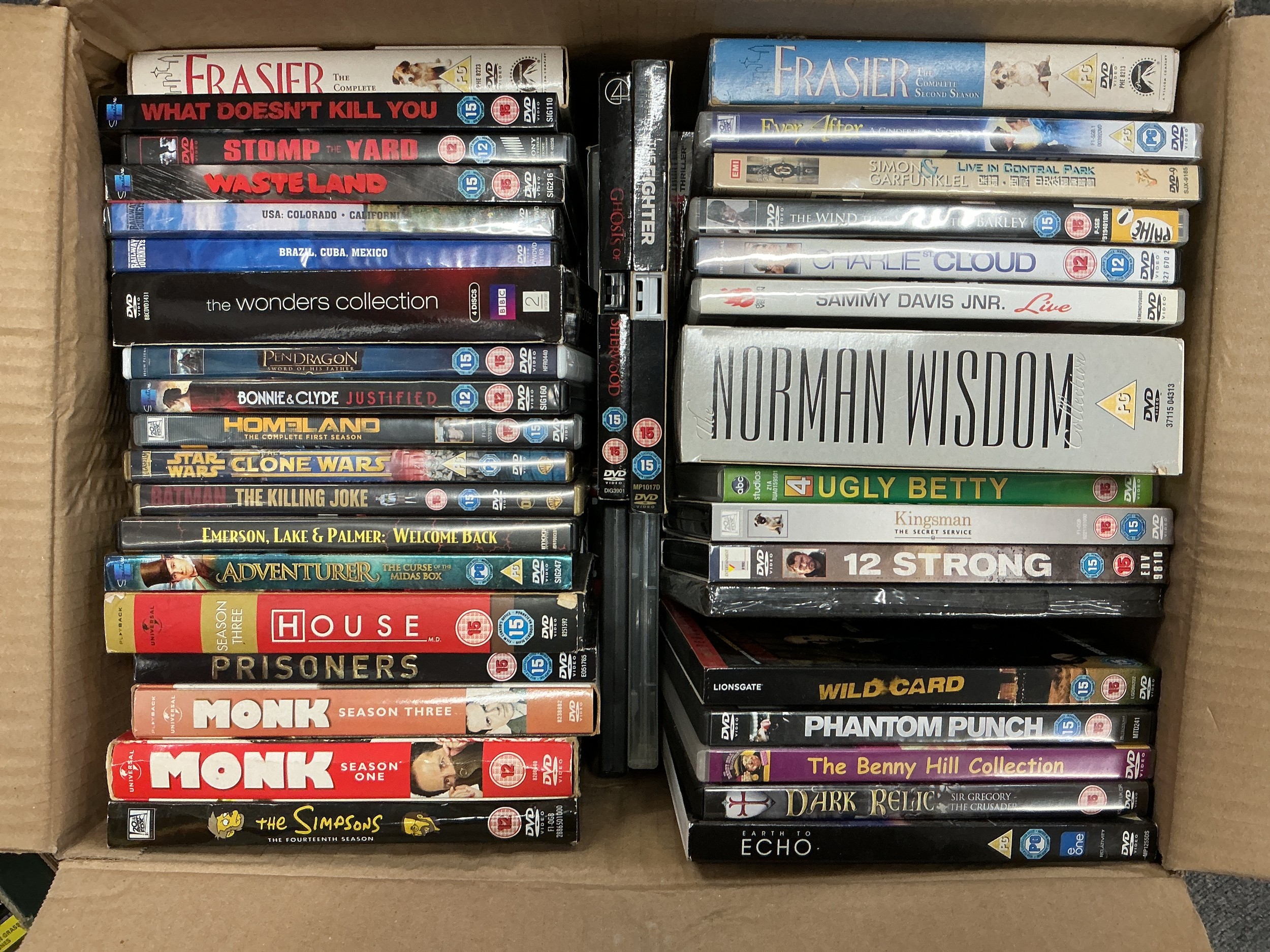 Four boxes of DVDs and BluRays.