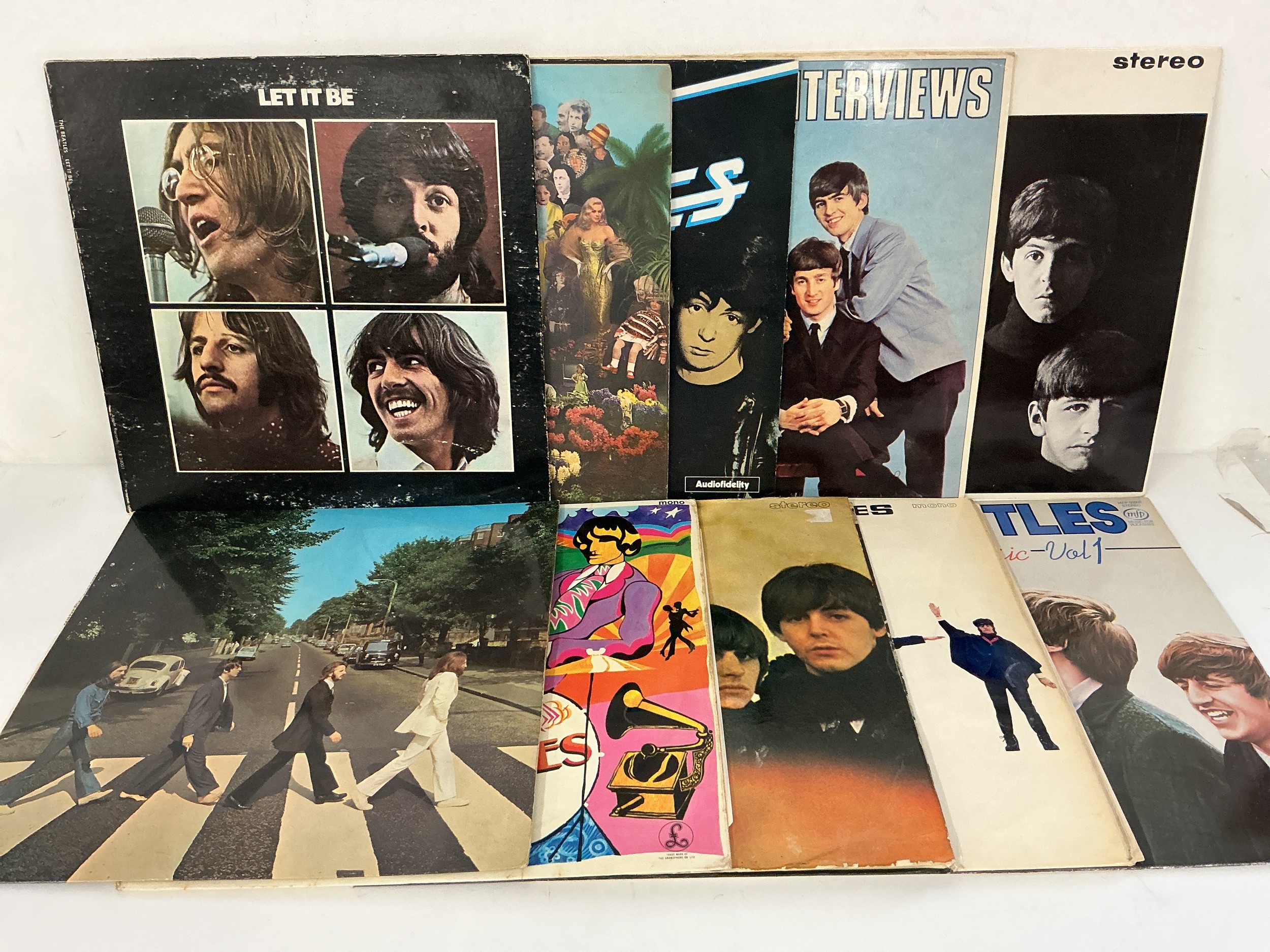 Ten Beatles LPs comprising a US pressing of Let It Be, Abbey Road, Sgt Pepper and others.
