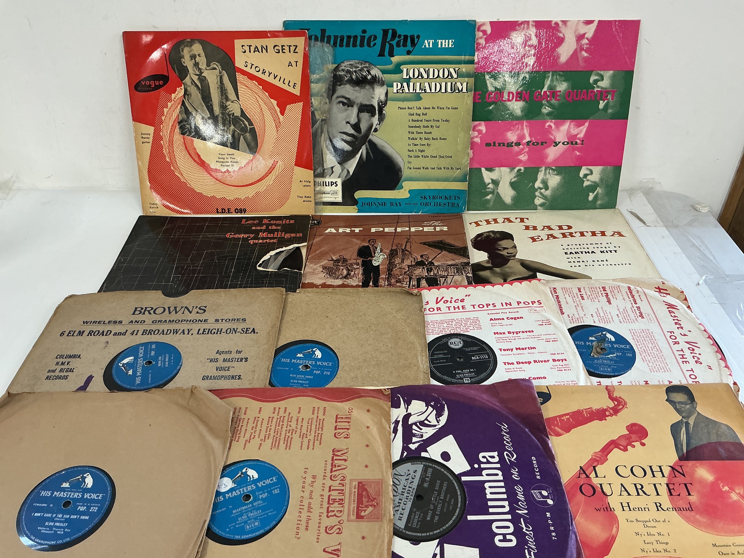 A record case and two boxes of 78s by various artists including Elvis Presley, Johnnie Ray, Stan Getz, Art Pepper and many more.
