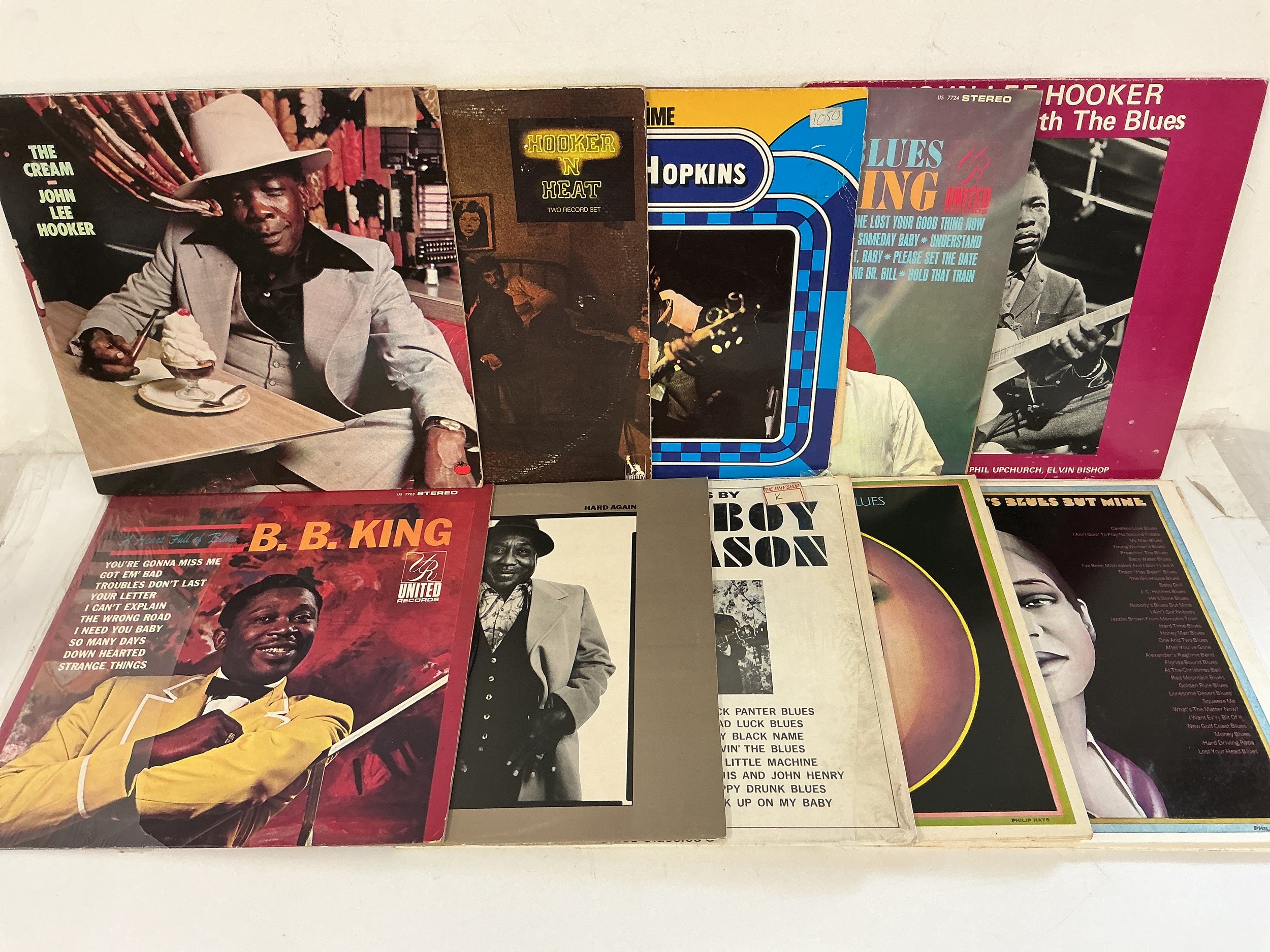 Two bags containing 13 blues LPs by various artists including BB King, John Lee Hooker, Muddy Waters and others.