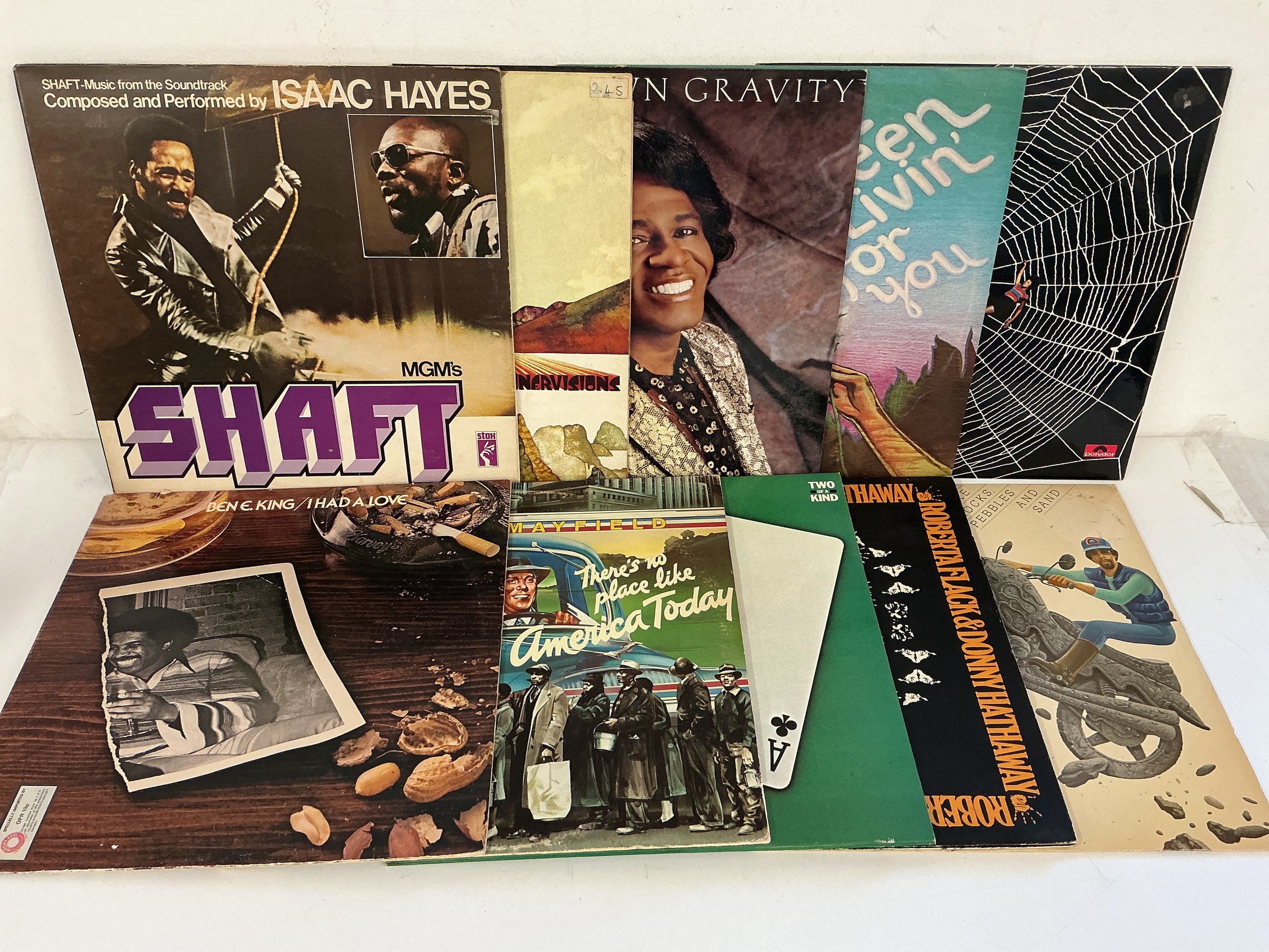 Two bags containing 21 soul and funk LPs by various artists including James Brown, Curtis Mayfield, Isaac Hayes and others.
