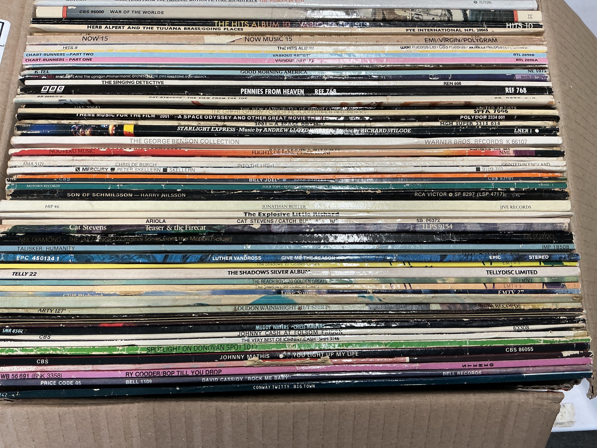 Two boxes of LPs and a small collection of 7" singles by various artists including Cream, Meat Loaf, Judy Collins, Talking Heads and many more.