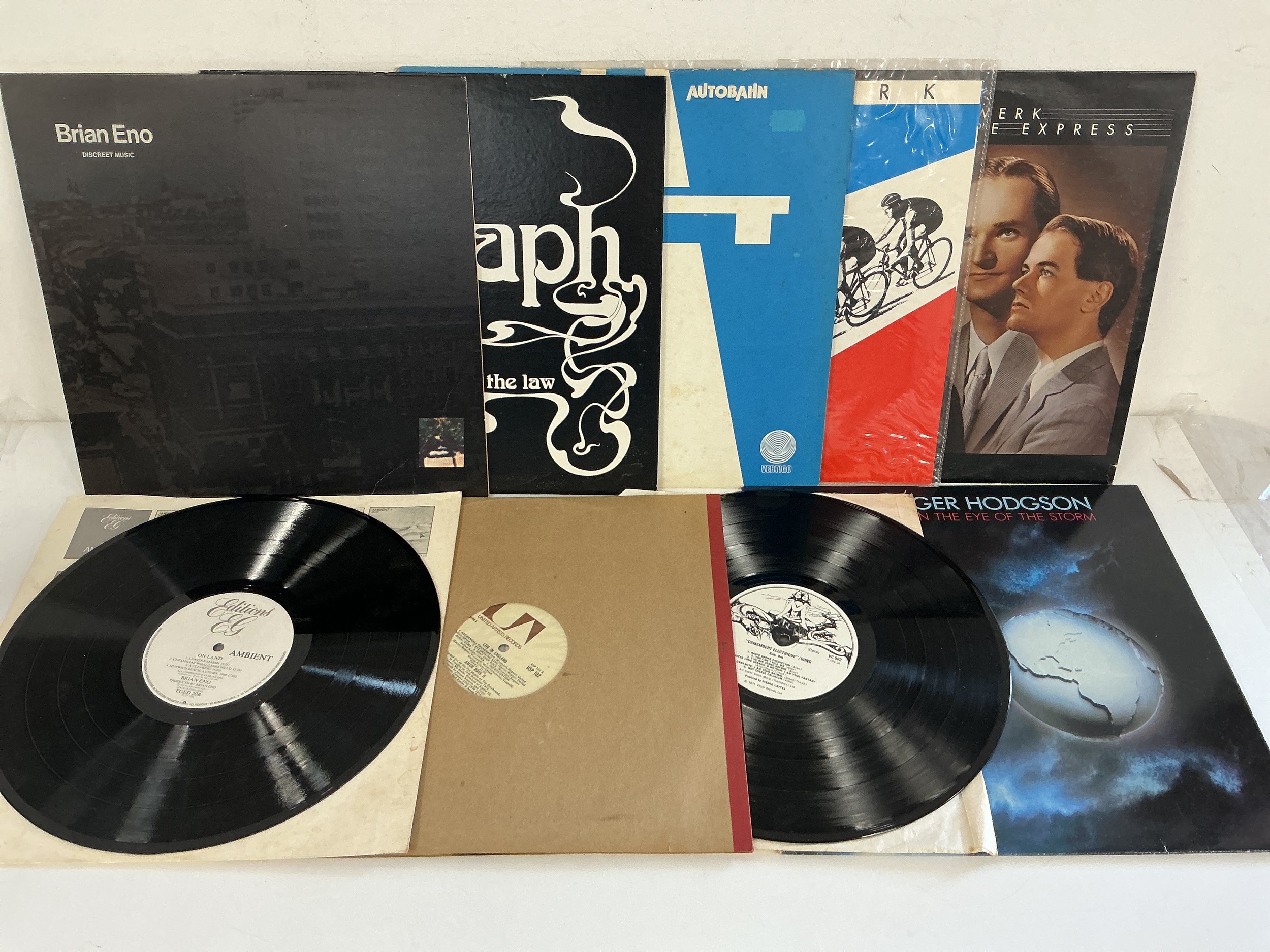 Nine electronic/ambient LPs and 12" singles by various artists including Kraftwerk, Brian Eno, Gong and others.