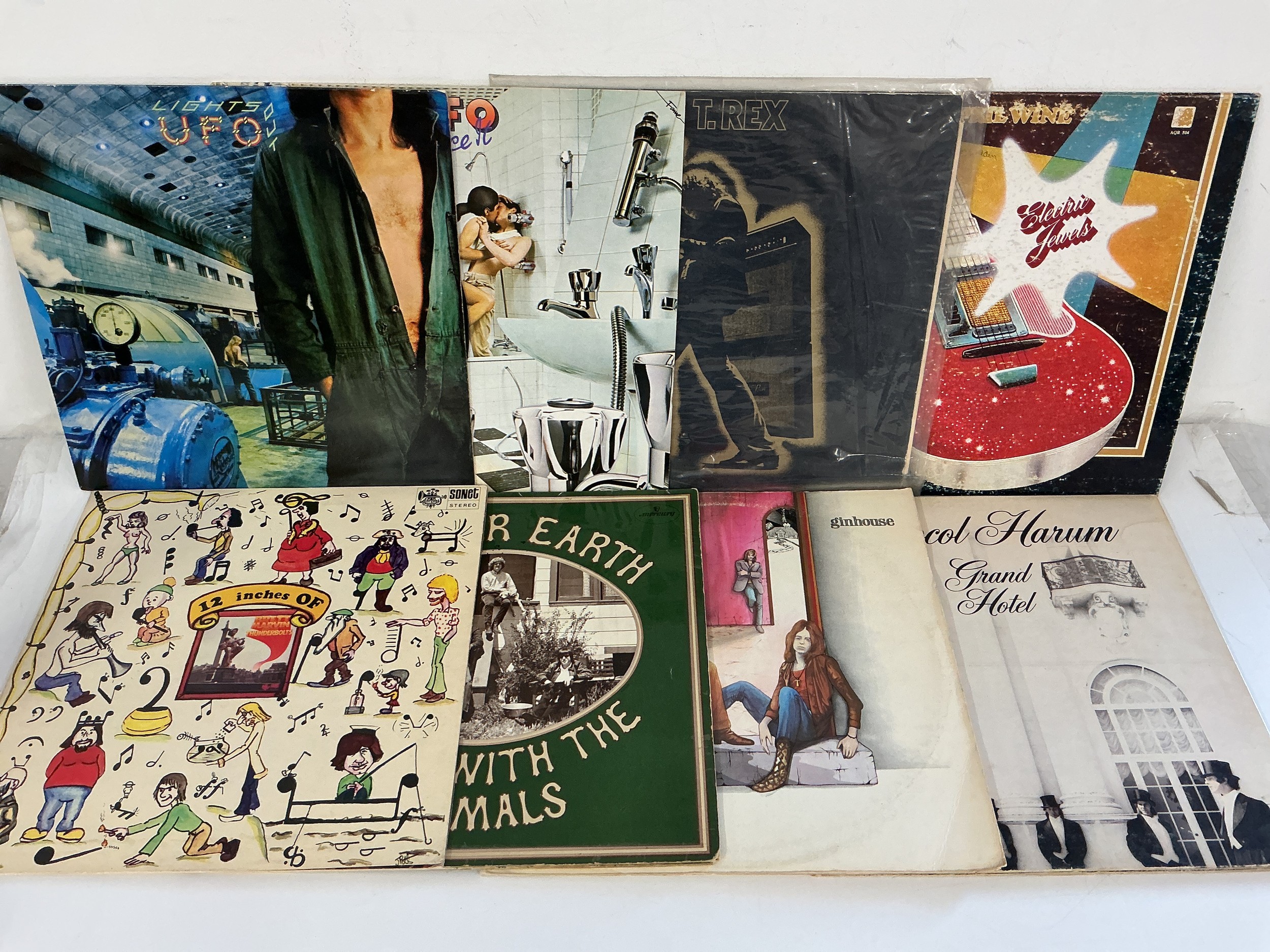 Two bags containing 16 rock LPs by various artists including David Bowie, UFO, Ginhouse and others.