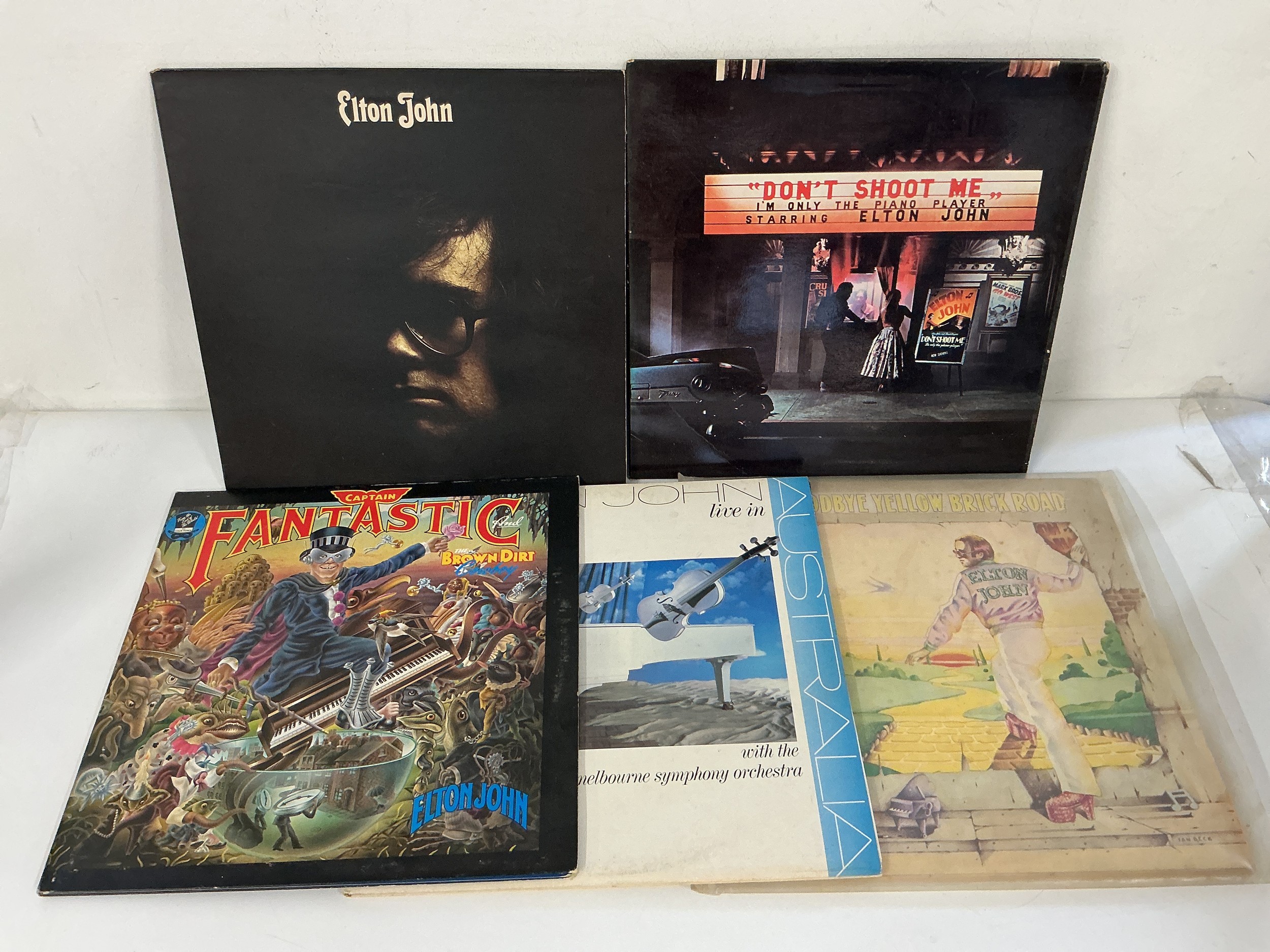 Five Elton John LPs comprising a yellow vinyl Goodbye Yellow Brick Road, Captain Fantastic And The Brown Dirt Cowboy and others.