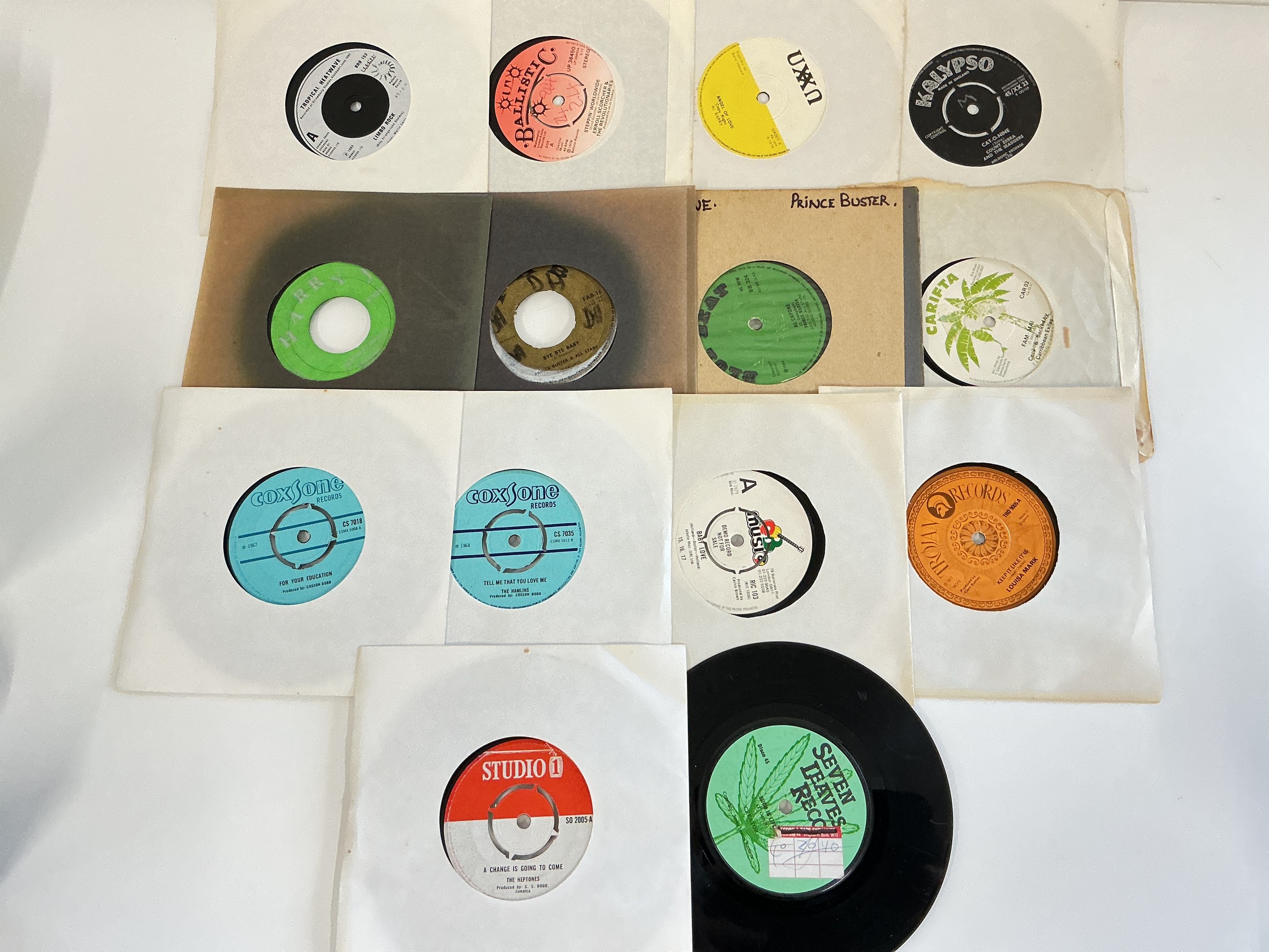 A small collection of reggae and blues 7" singles by various artists including The Heptones, Prince Buster, Marcia Griffiths and others.