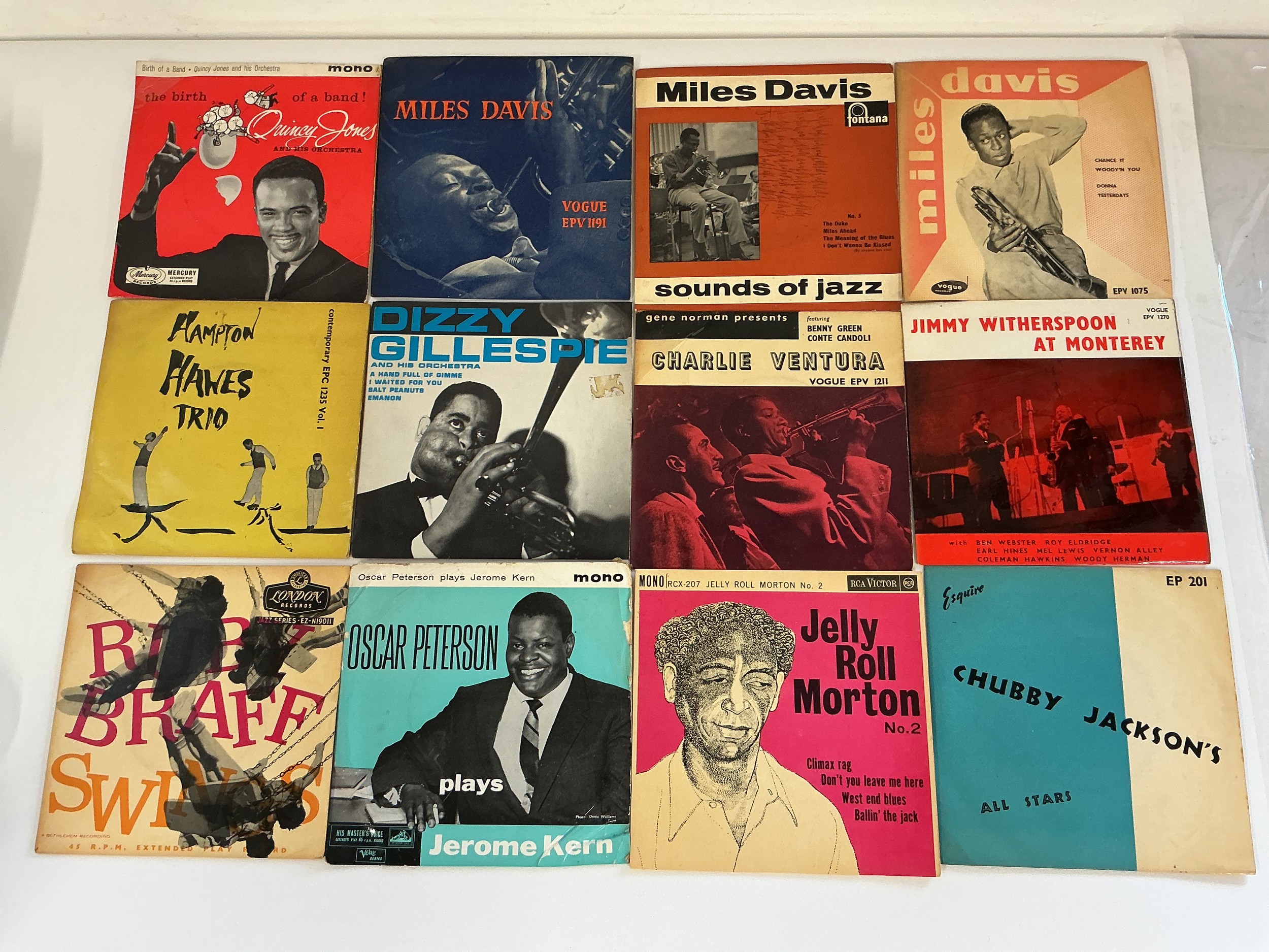 A collection of approx 40 jazz and blues EPs by various artists including Miles Davis, Dizzy Gillespie, Jelly Roll Morton, Hampton Hawes Trio and others.