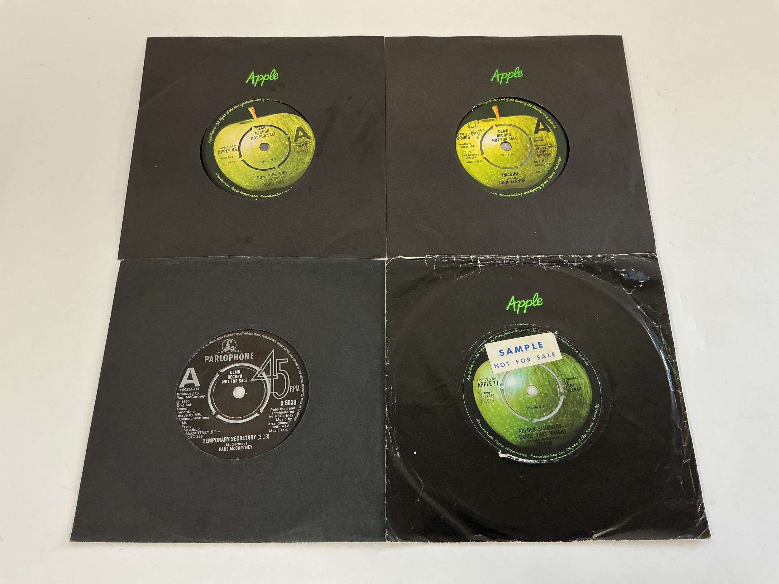 Four Beatles related UK demo discs comprising Imagine R 6009, Temporary Secretary R 6039, Run Run Run APPLE 48 and Golden Slumbers by Trash APPLE 17.