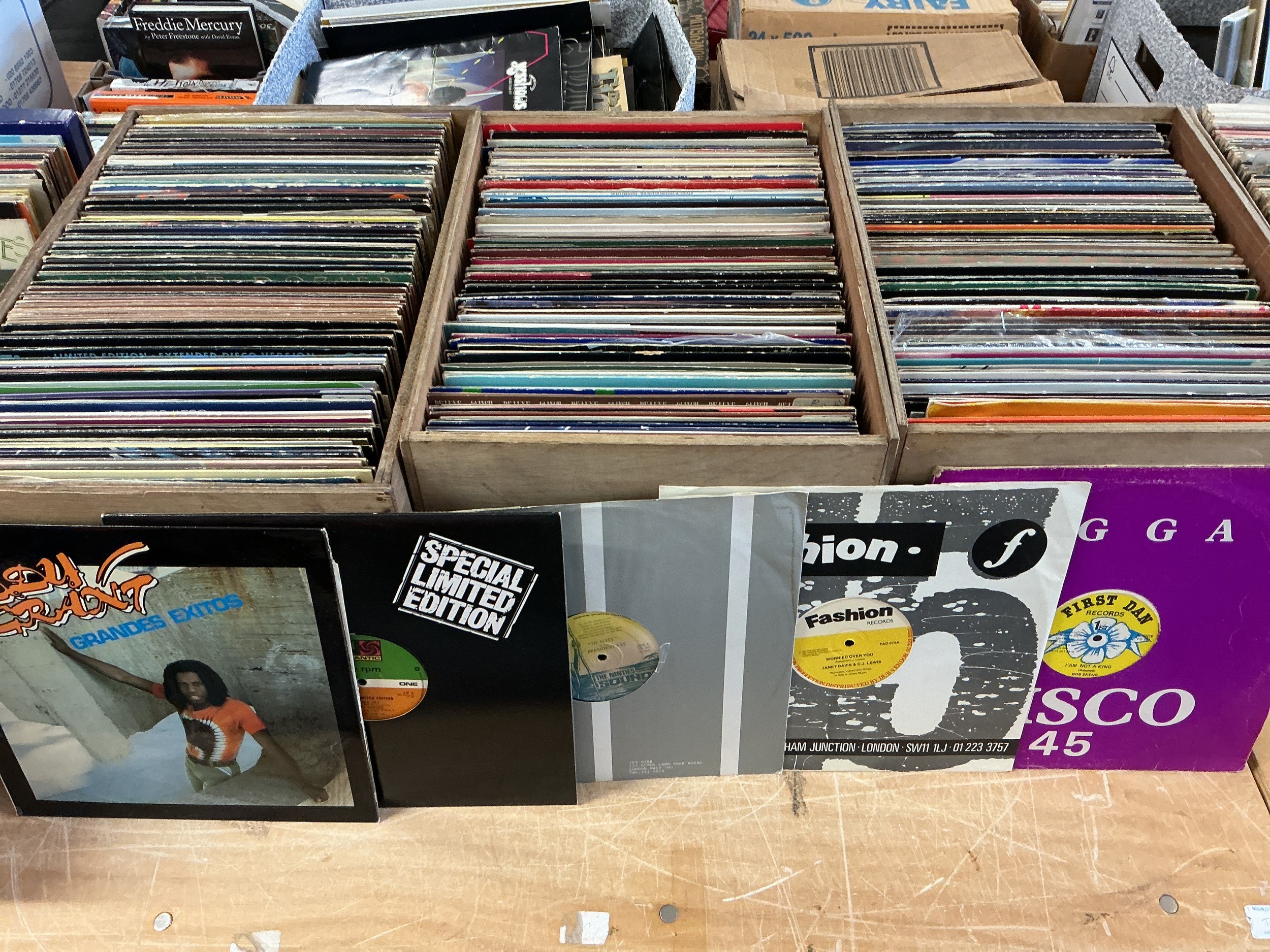 Four boxes containing a large collection of LPs and 12" singles comprising mainly reggae, funk and jazz titles.