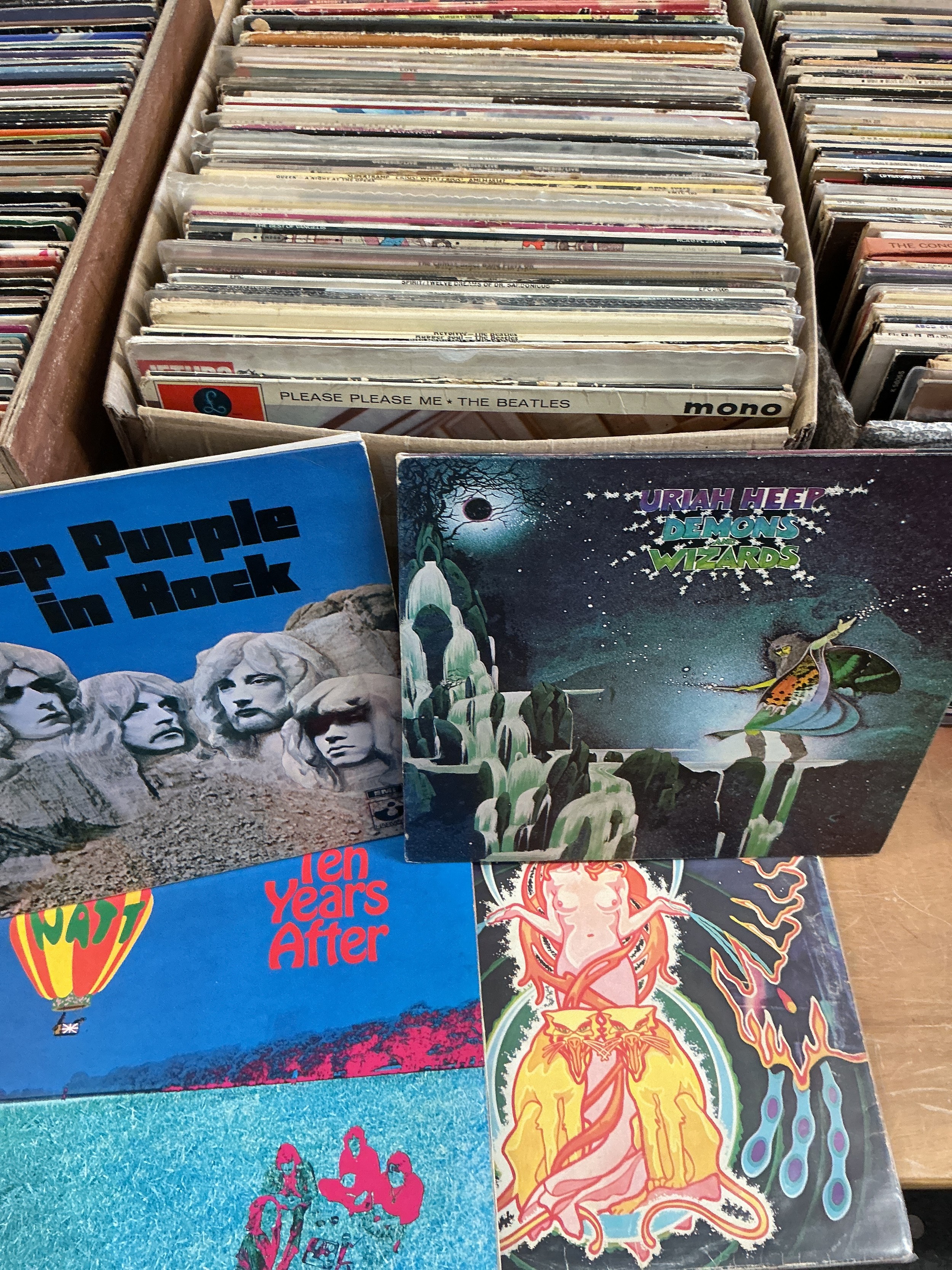 A box of rock and pop LPs by various artists including Queen, The Who, The Beatles, Deep Purple and others. Includes some white label discs.