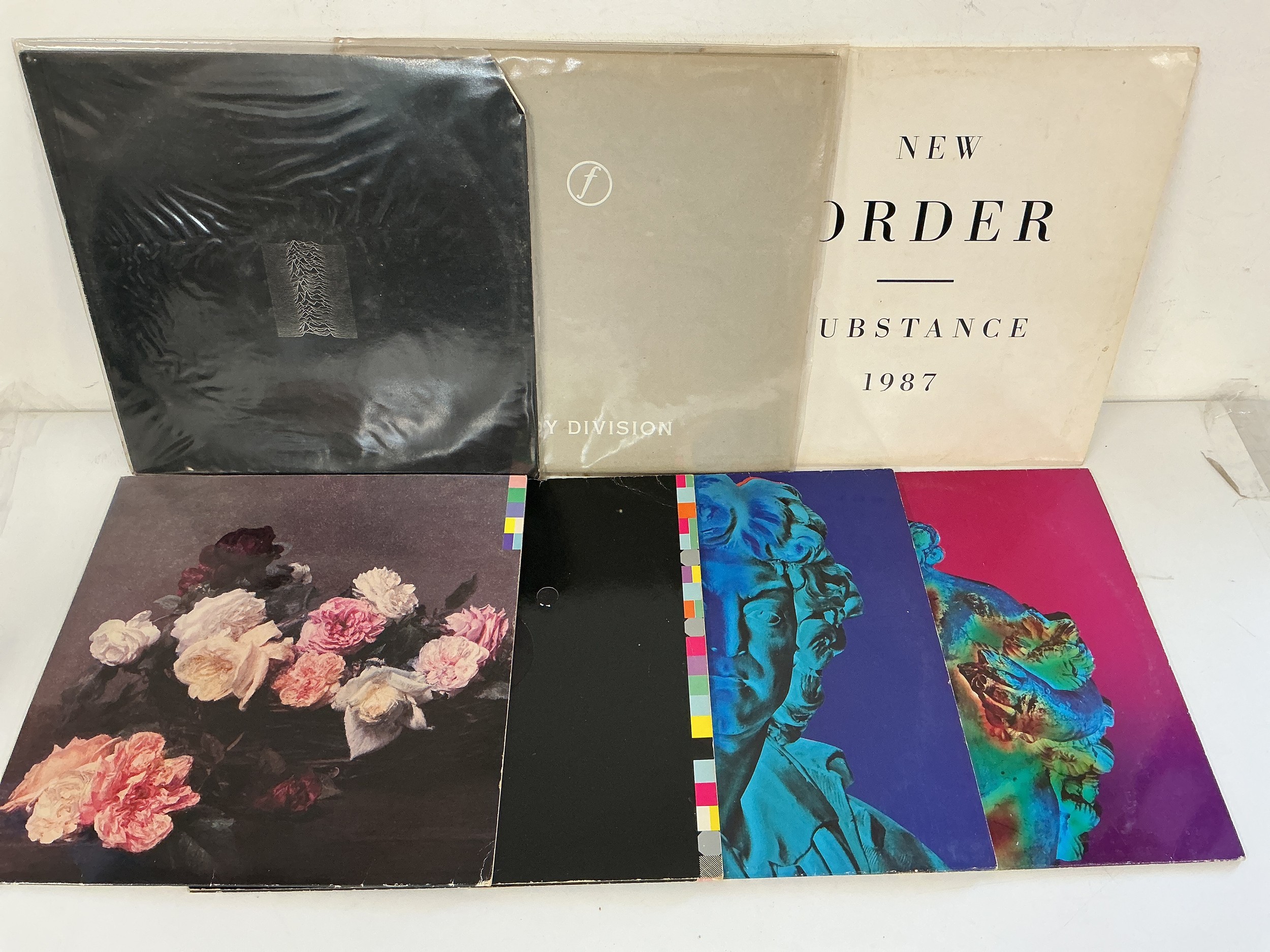 Seven Joy Division / New Order LPs and 12" singles including Unknown Pleasures, Substance, Power Corruption & Lies and others.