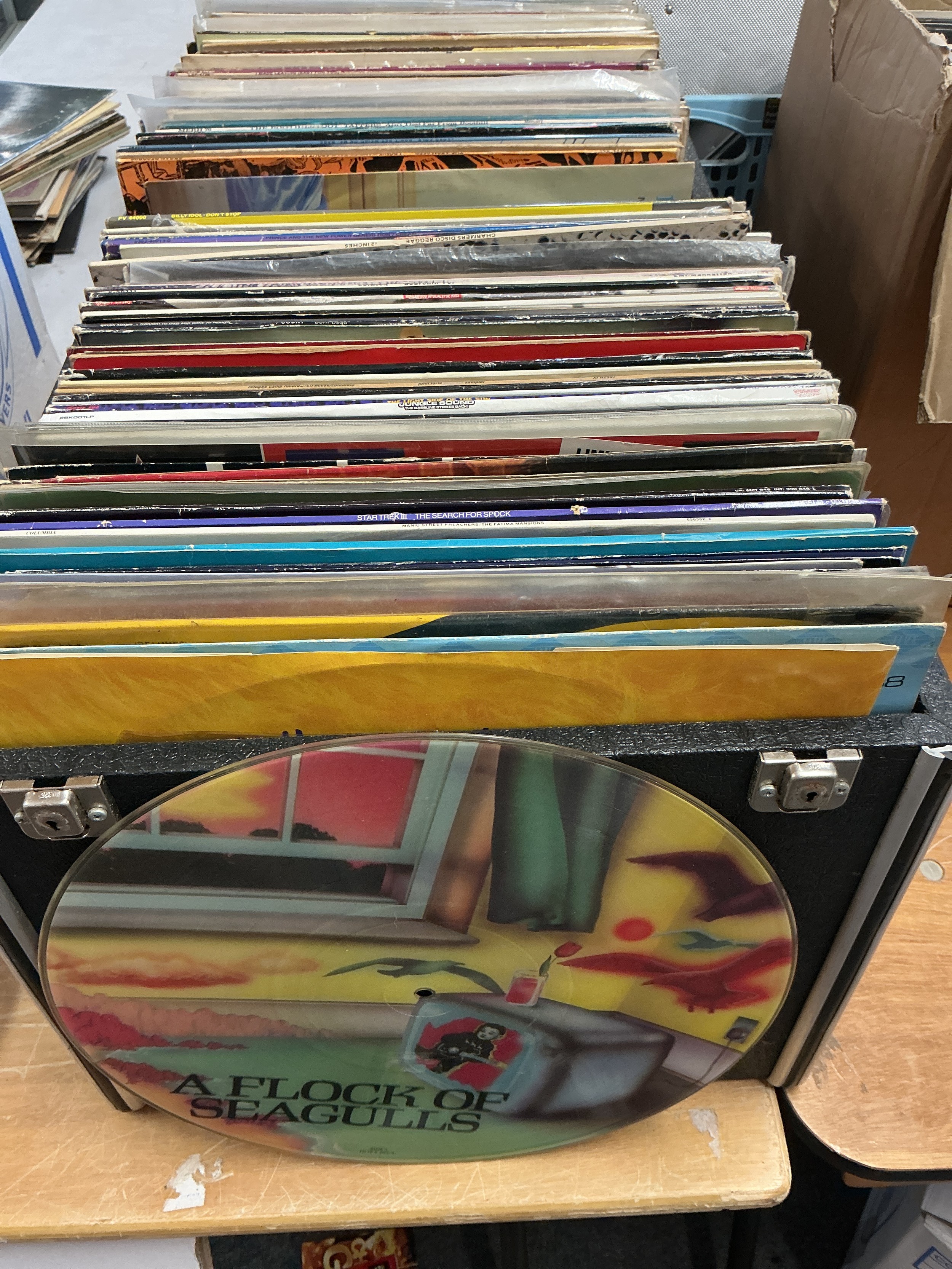 Two boxes of 12" singles and LPs by various artists including Prince, Paul McCartney, David Bowie, Manic Street Preachers and others.