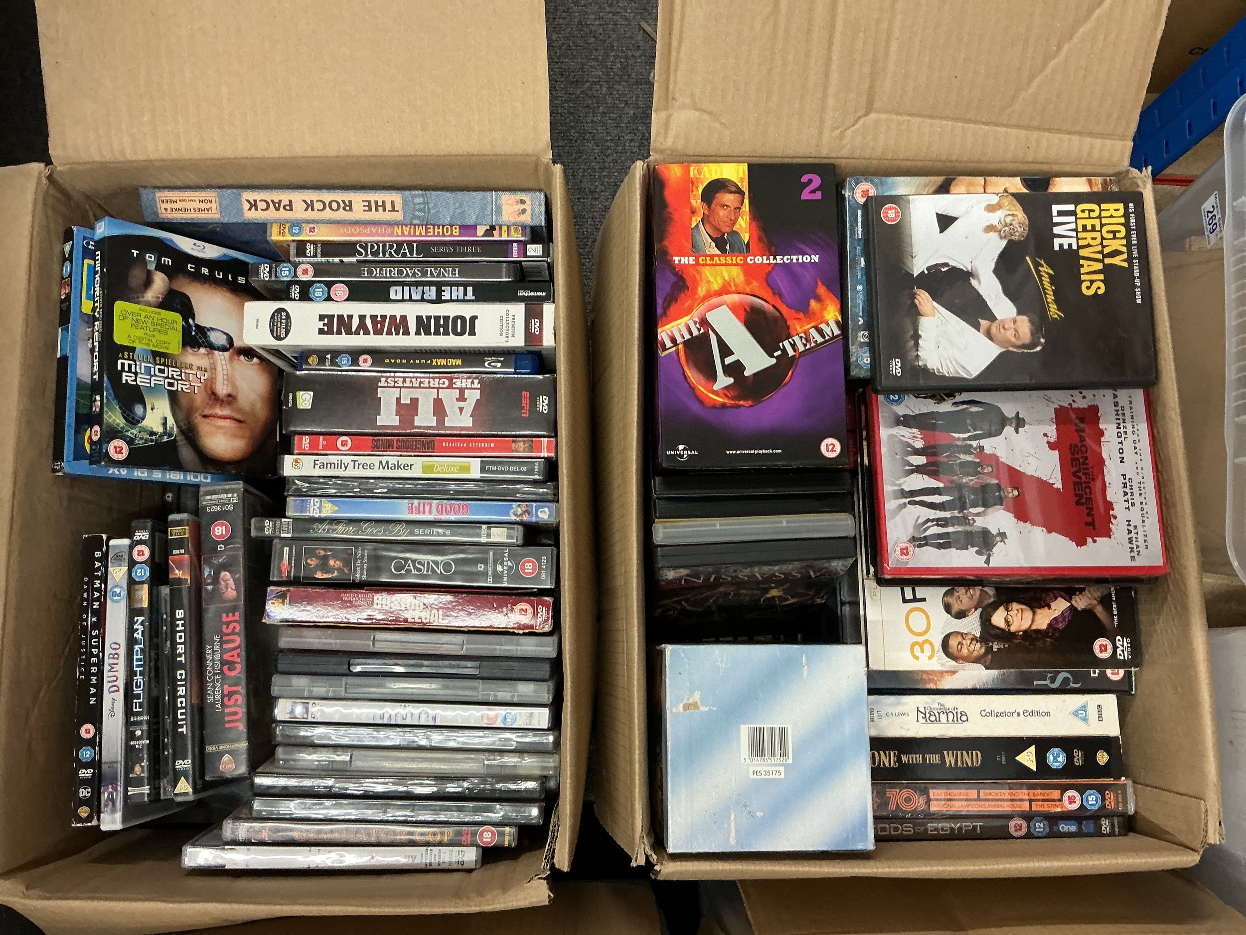 Four boxes of DVDs, VHS tapes etc.
