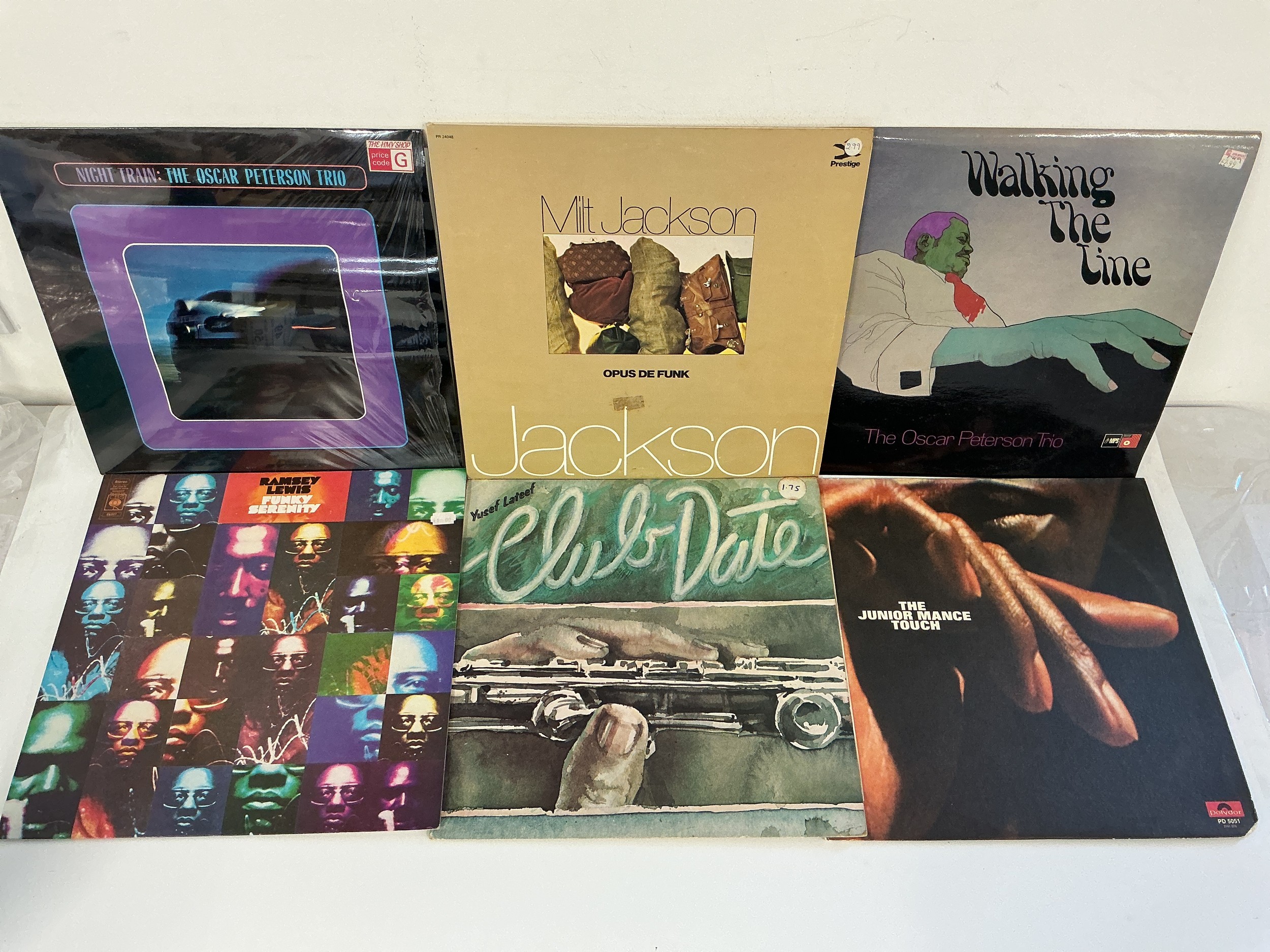 Thirteen jazz LPs by various artists including Ramsey Lewis, Milt Jackson, Oscar Peterson and others.