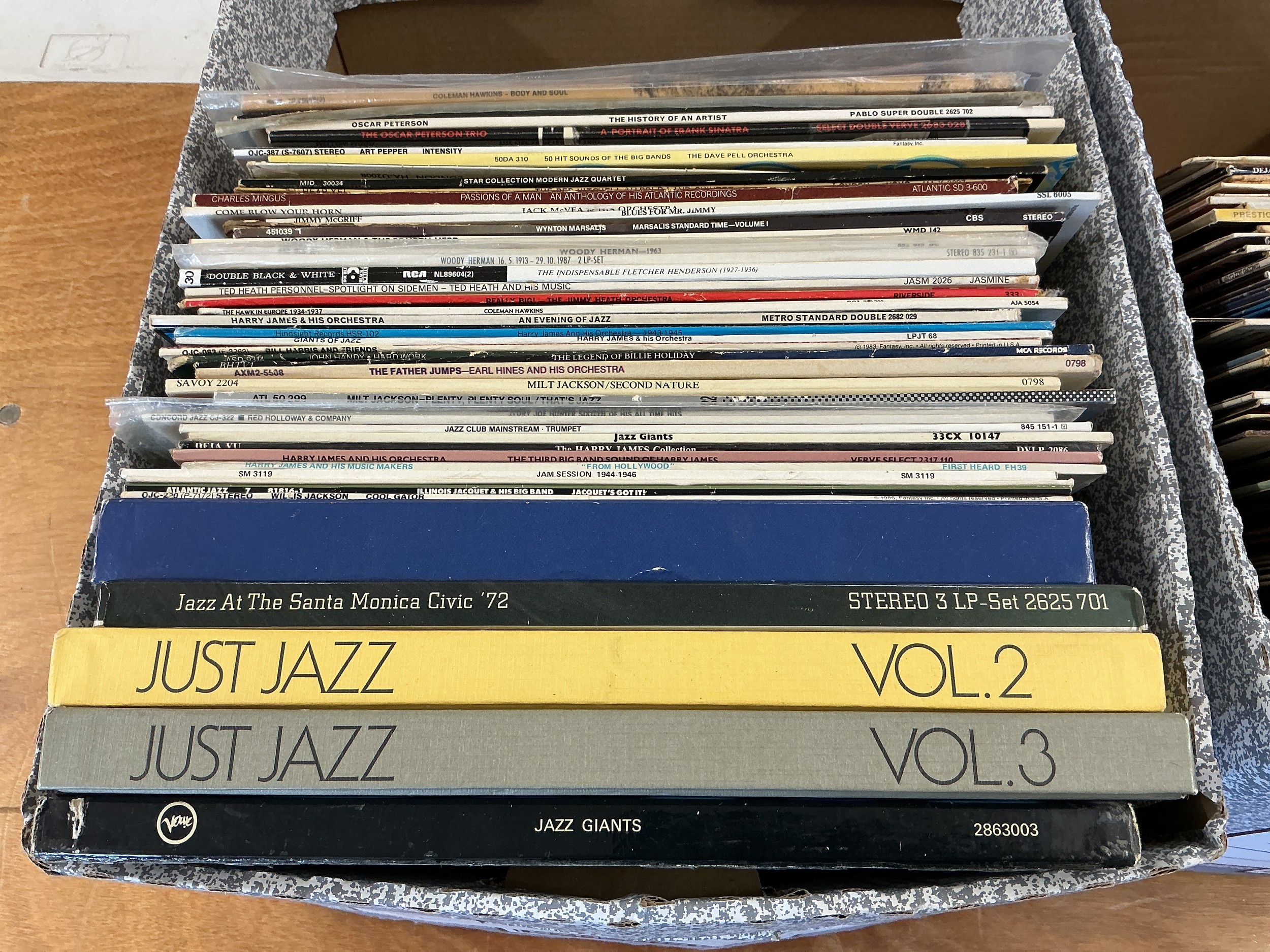 Two boxes of jazz LPs by various artists including Stan Getz, Charlie Parker, Milt Jackson and others.