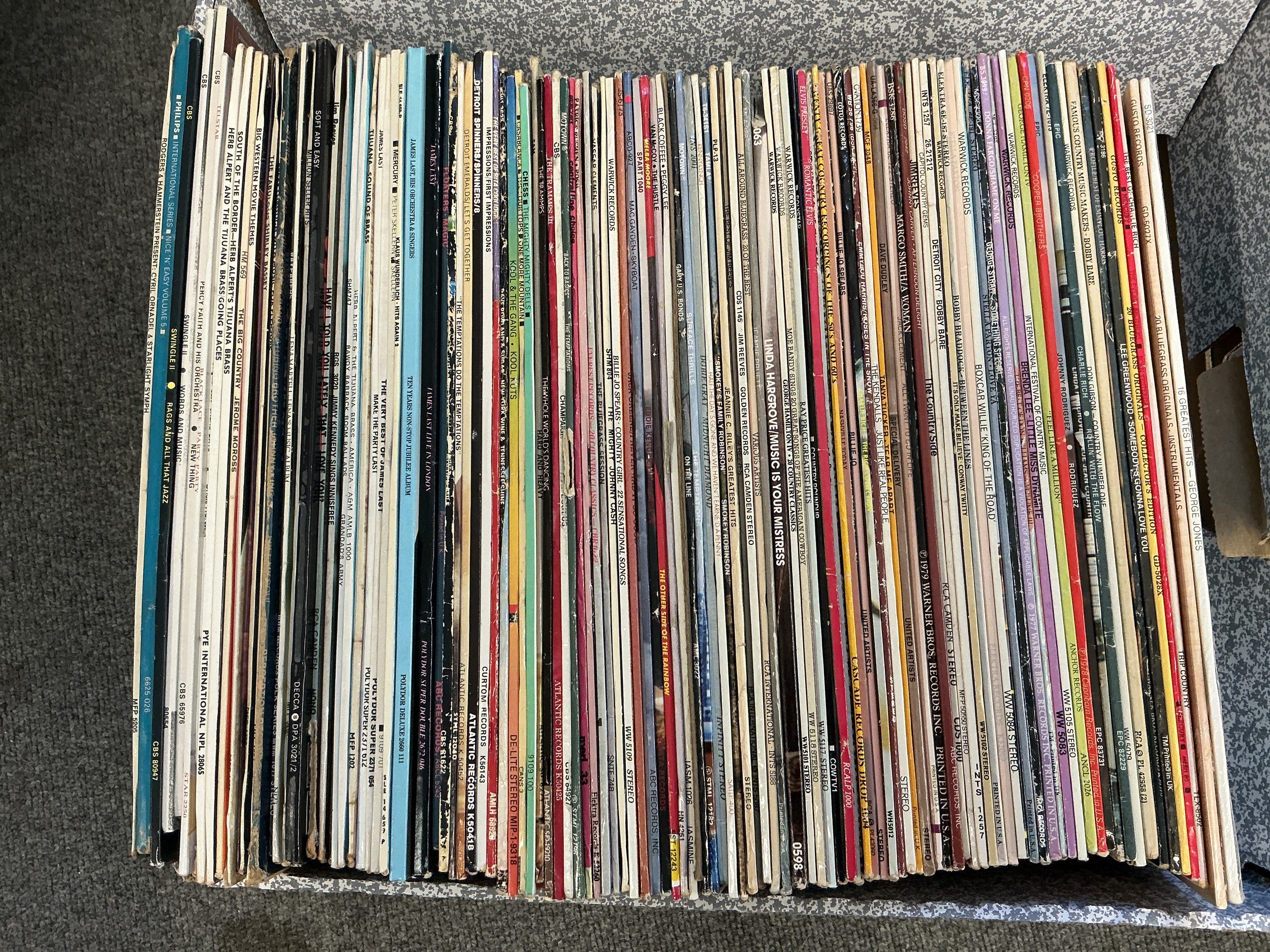 Two boxes of LPs and CDs by various artists including Elvis Presley, Kool & The Gang, The Impressions and others.