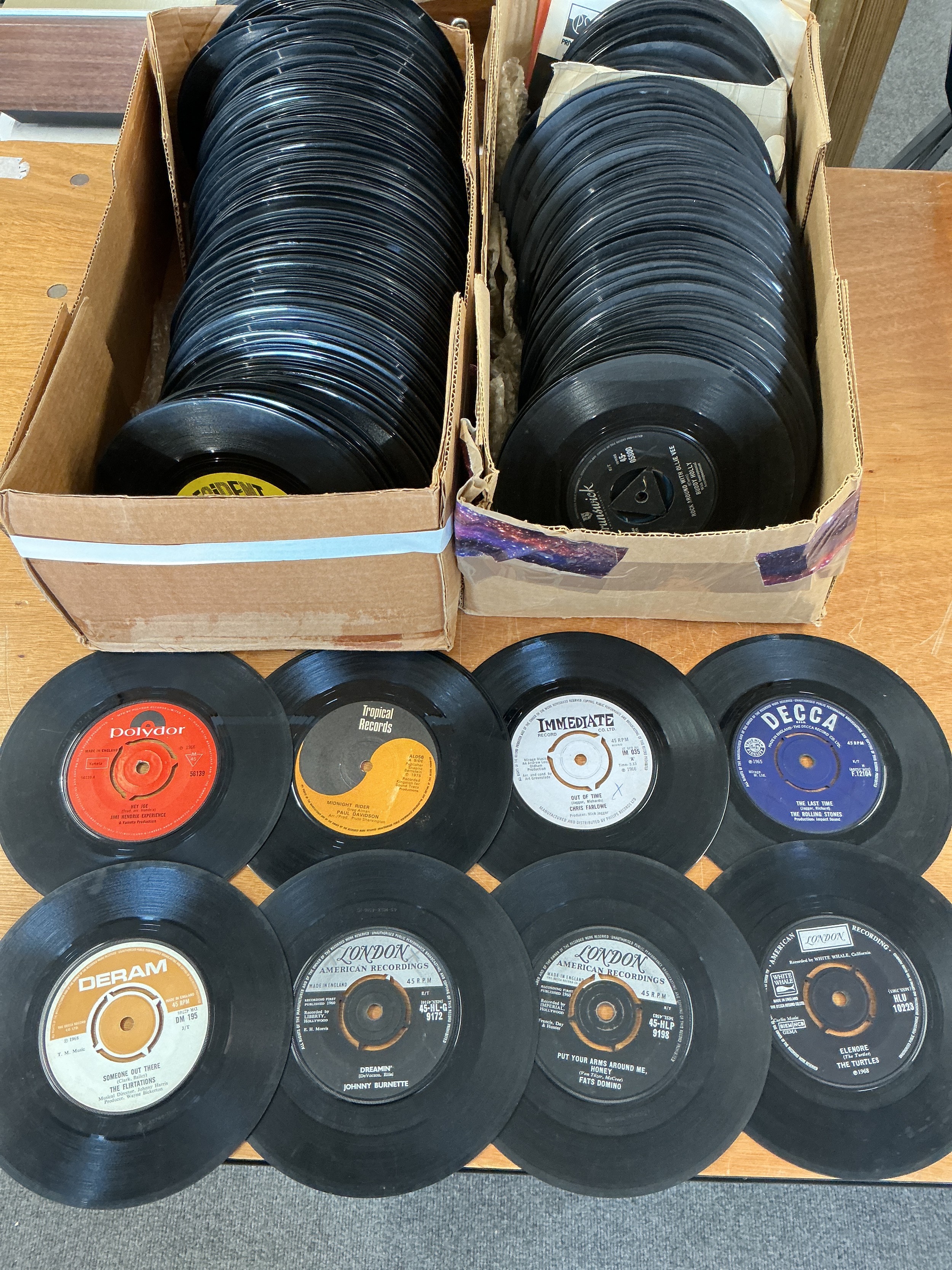 Two boxes 7" and EPs various artists including Jimi Hendrix, The Beatles, The Rolling Stones and many more.